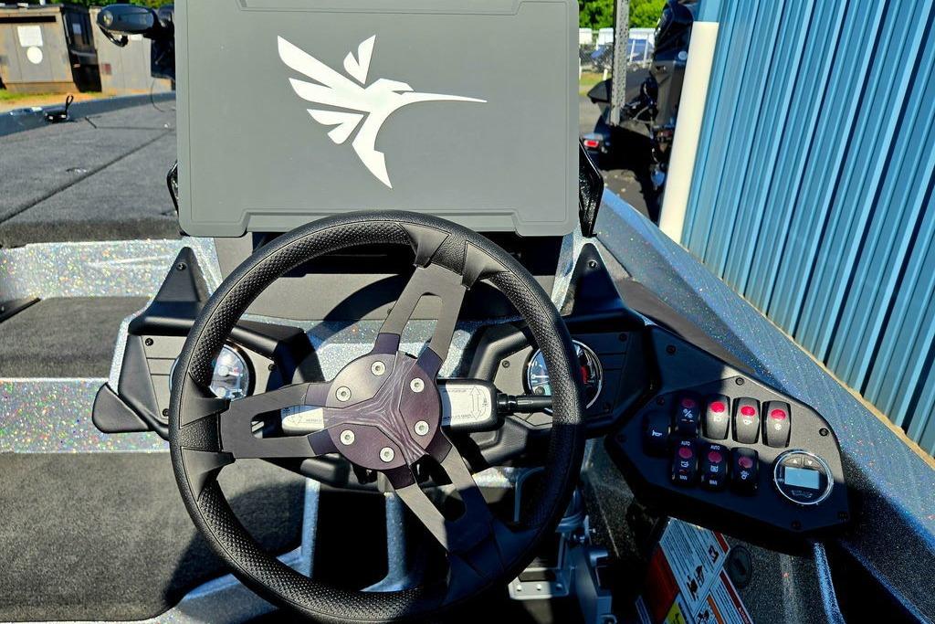 Steering console of 2026 Skeeter ZXE20 boat with control panel and logo.