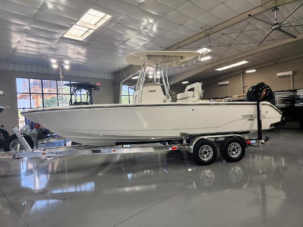 2025 Pathfinder 2400 Open boat on trailer in showroom.