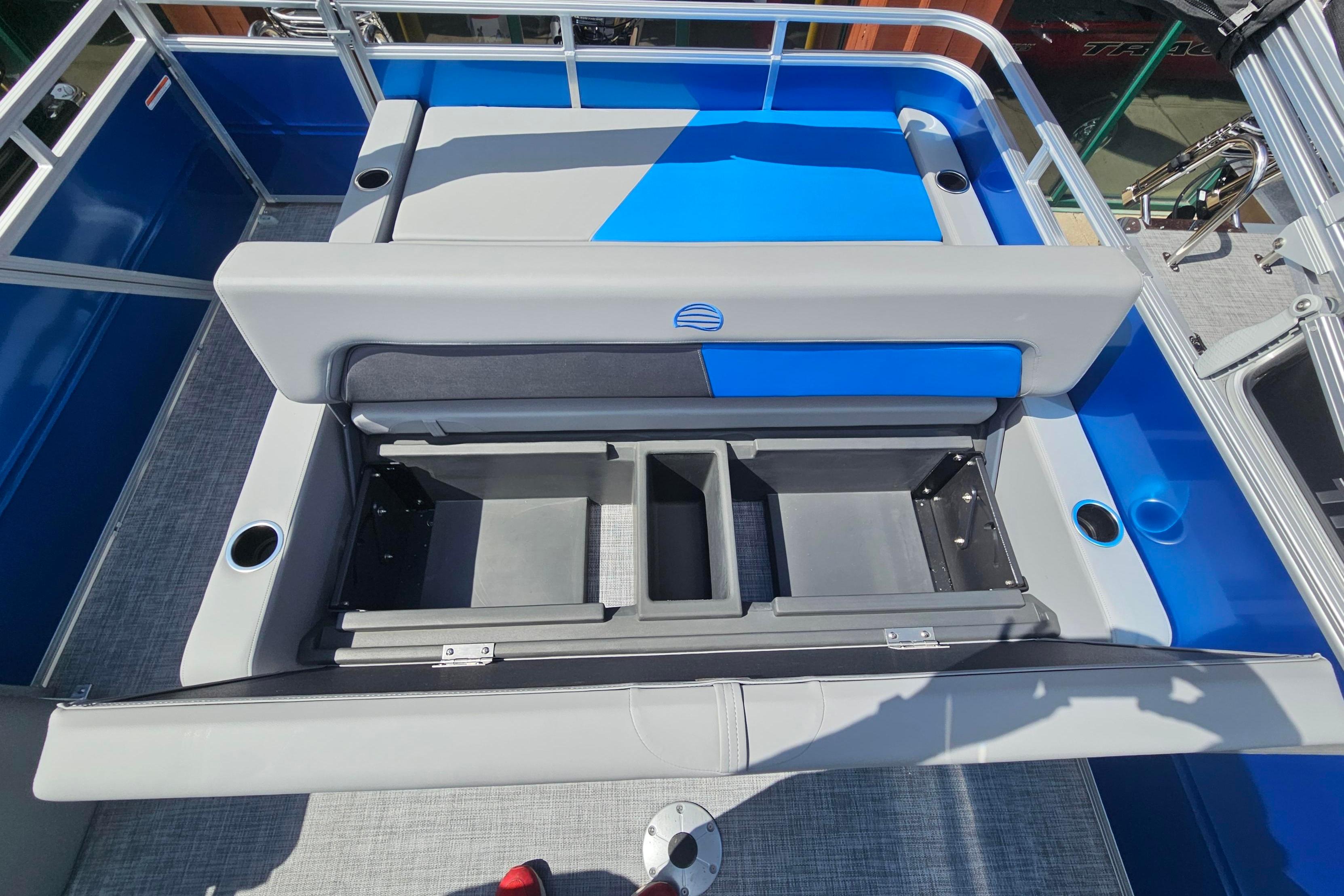 2026 Sun Tracker Party Barge 22 RF DLX with open storage compartments and seating area.