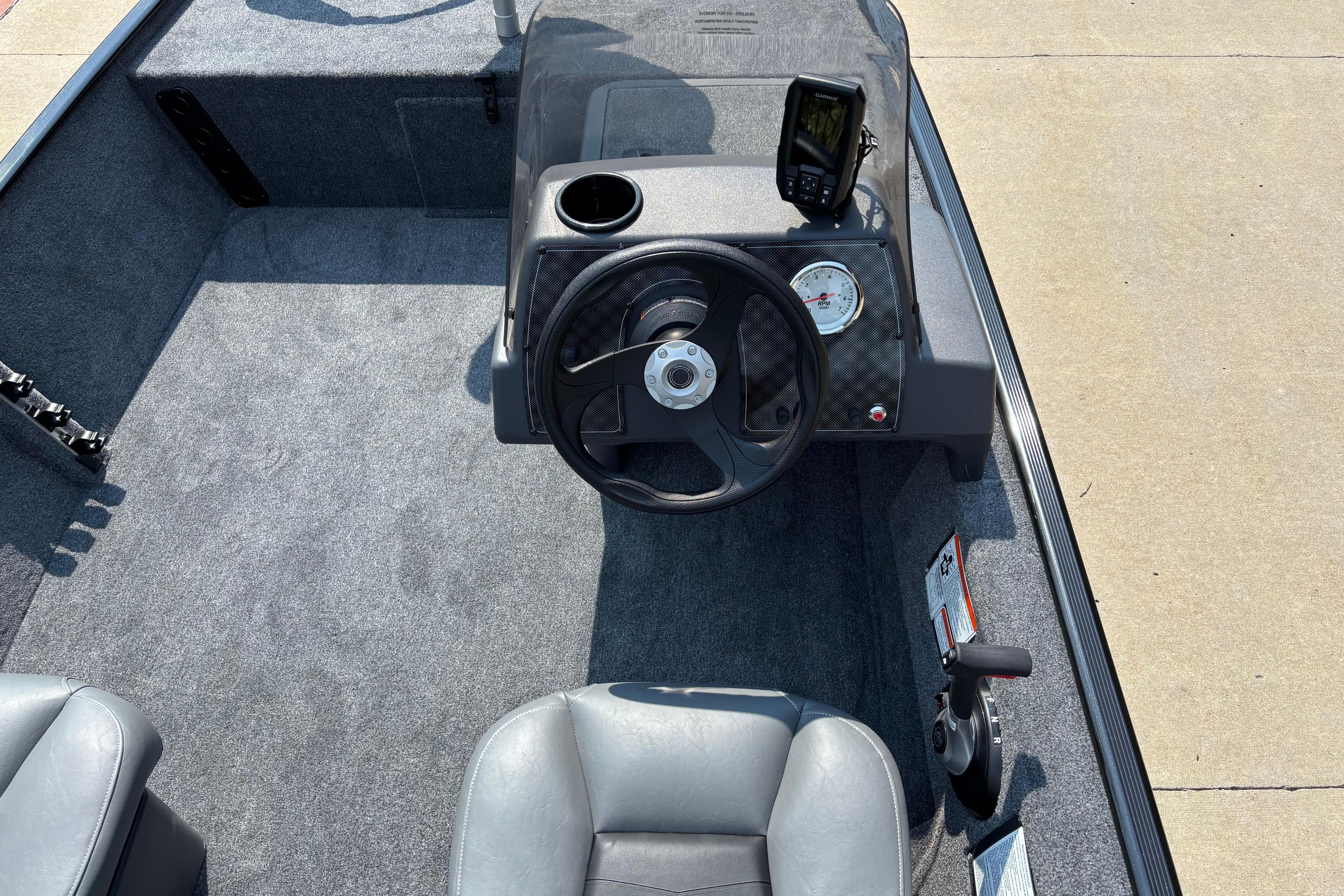 2026 Tracker Bass Tracker Classic XL boat interior with steering wheel and dashboard controls.