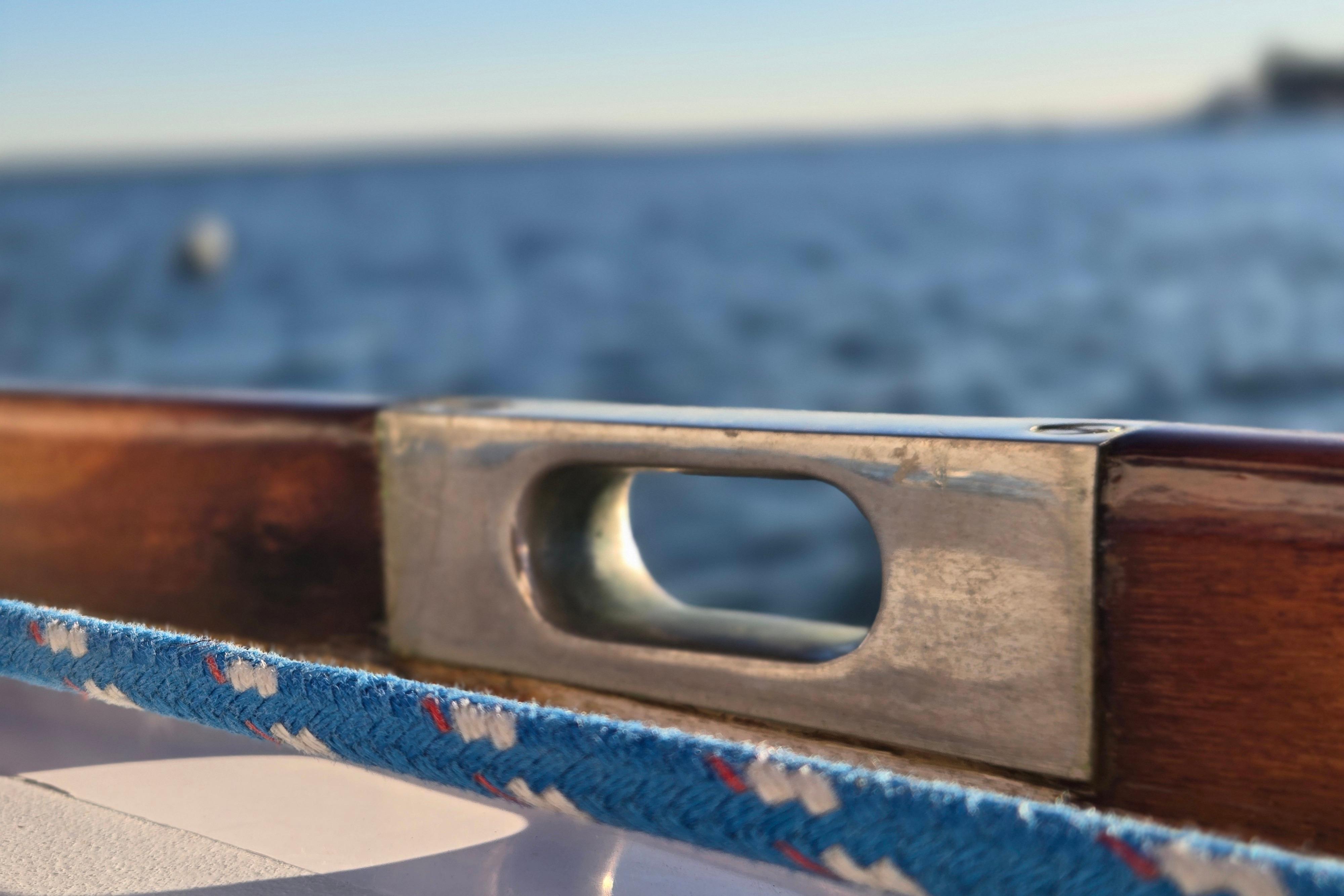Close-up of a Hinckley Bermuda 40 sailboat detail, 1970, with ocean background.