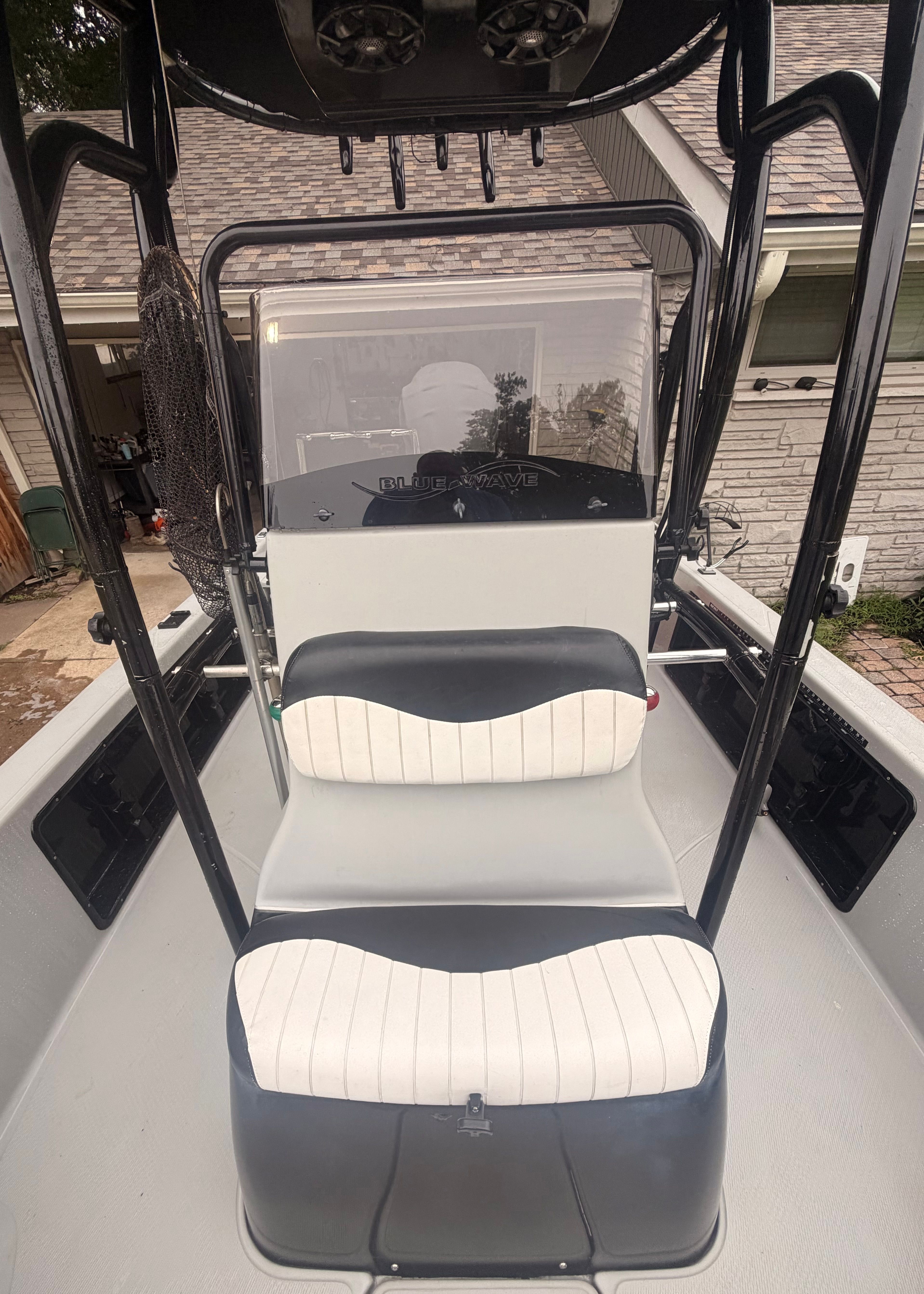 The image shows the cockpit of a 2013 Blue Wave Pure Bay 2200 boat.