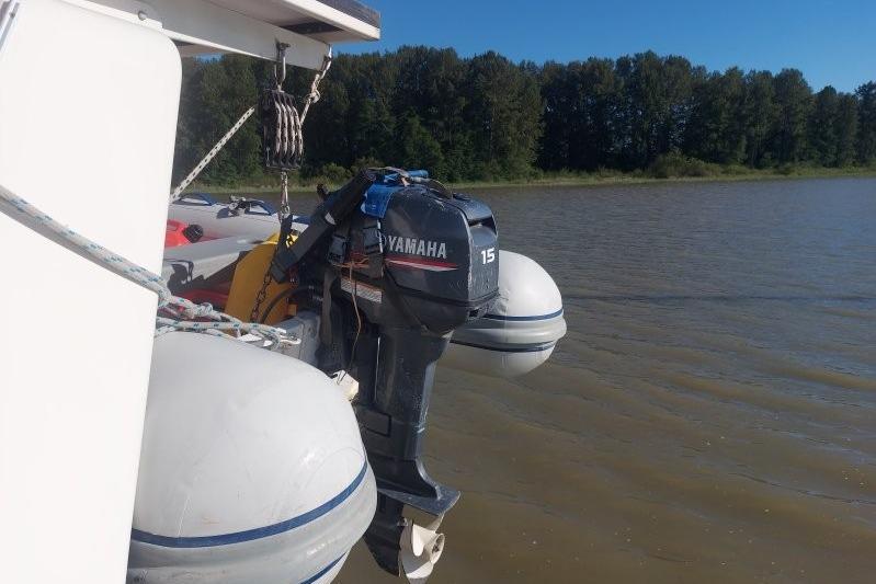 Custom Chatam Extreme 42 boat with Yamaha 15 outboard motor on a calm river.