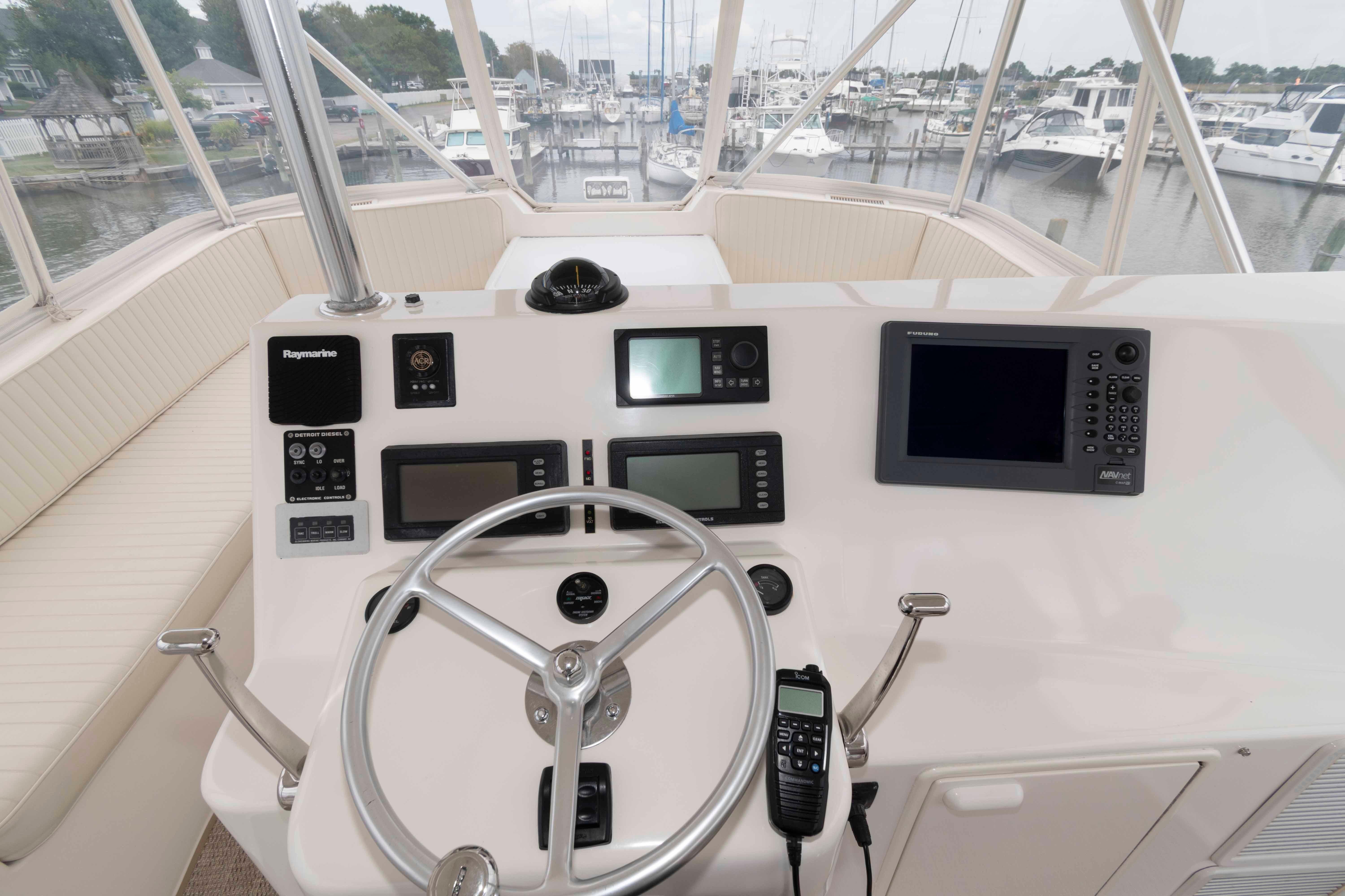 Cockpit view of 2004 Ocean Yachts 52 SUPER SPORT with navigation equipment and steering wheel.