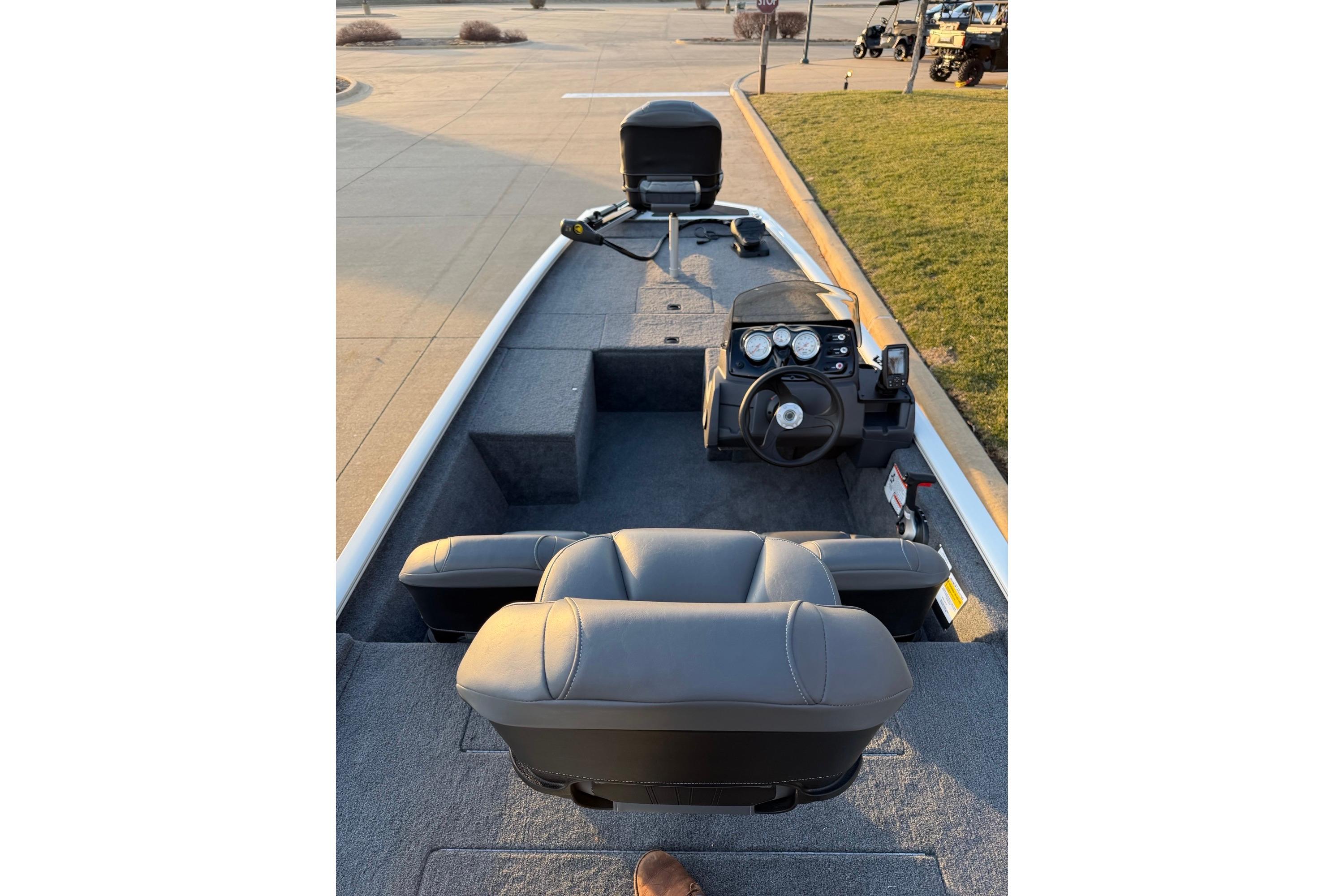 2026 Tracker Pro 170 boat interior with steering console and seating.