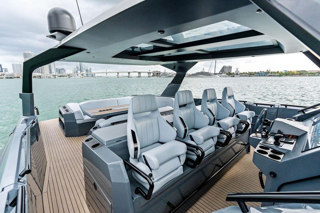 Luxurious 2024 Vanquish Yachts VQ55 interior with sleek seating and modern design on open water.