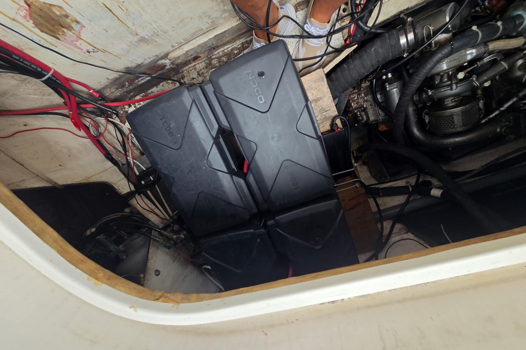 Engine compartment of a 2000 Fountaine Pajot Maryland 37 with visible wiring and components.