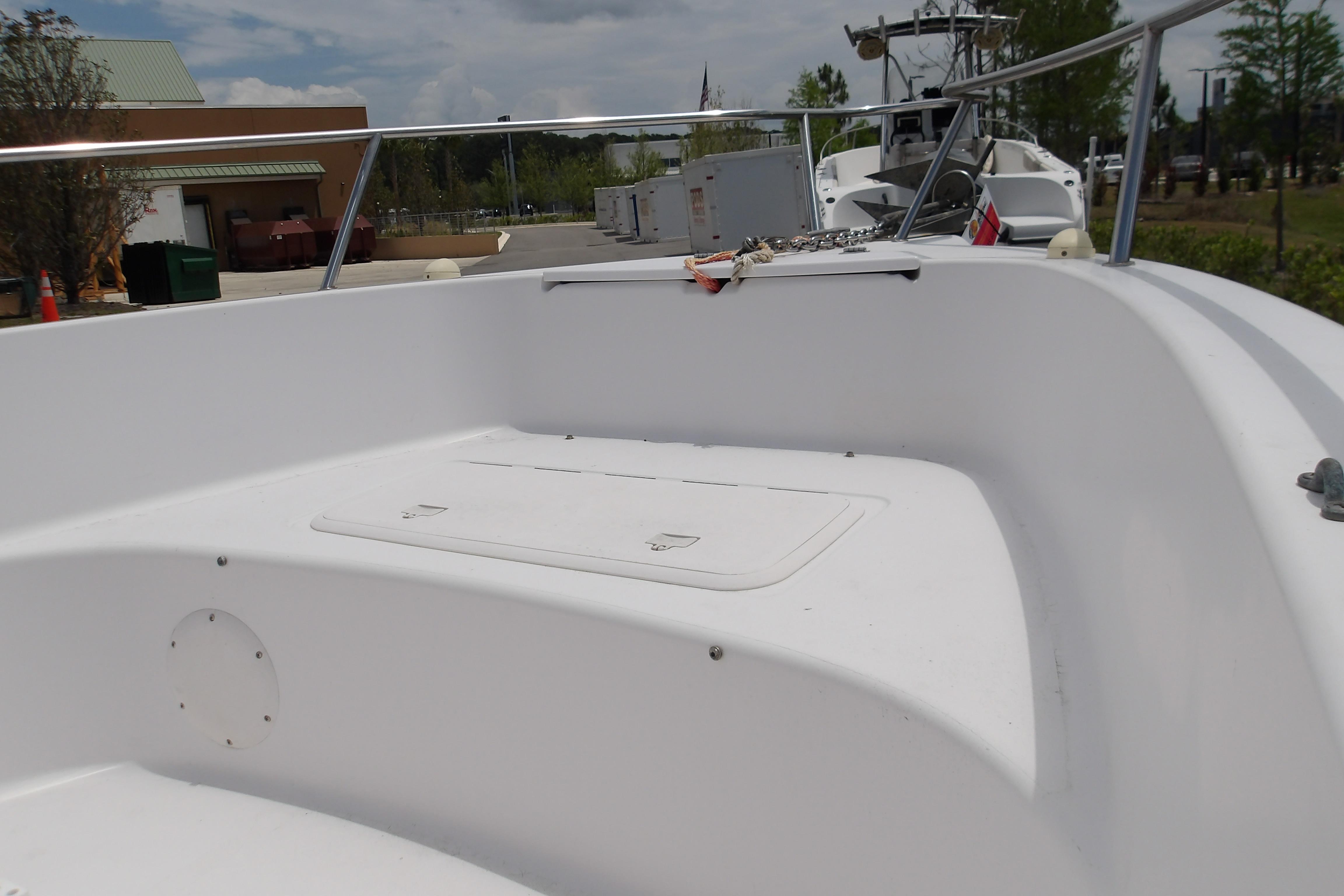 2000 Pro-Line 19 Sport boat interior with white seating and storage compartment.