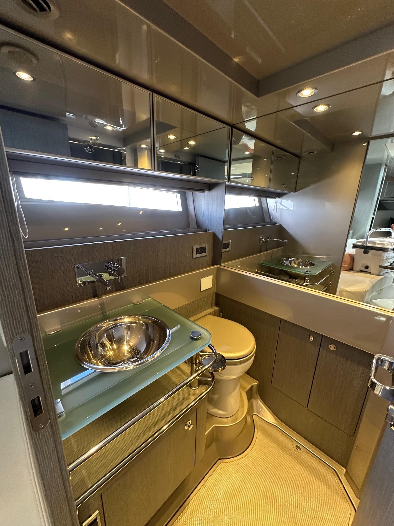 Luxurious bathroom interior of 2015 Riva Rivarama Super yacht with modern fixtures.