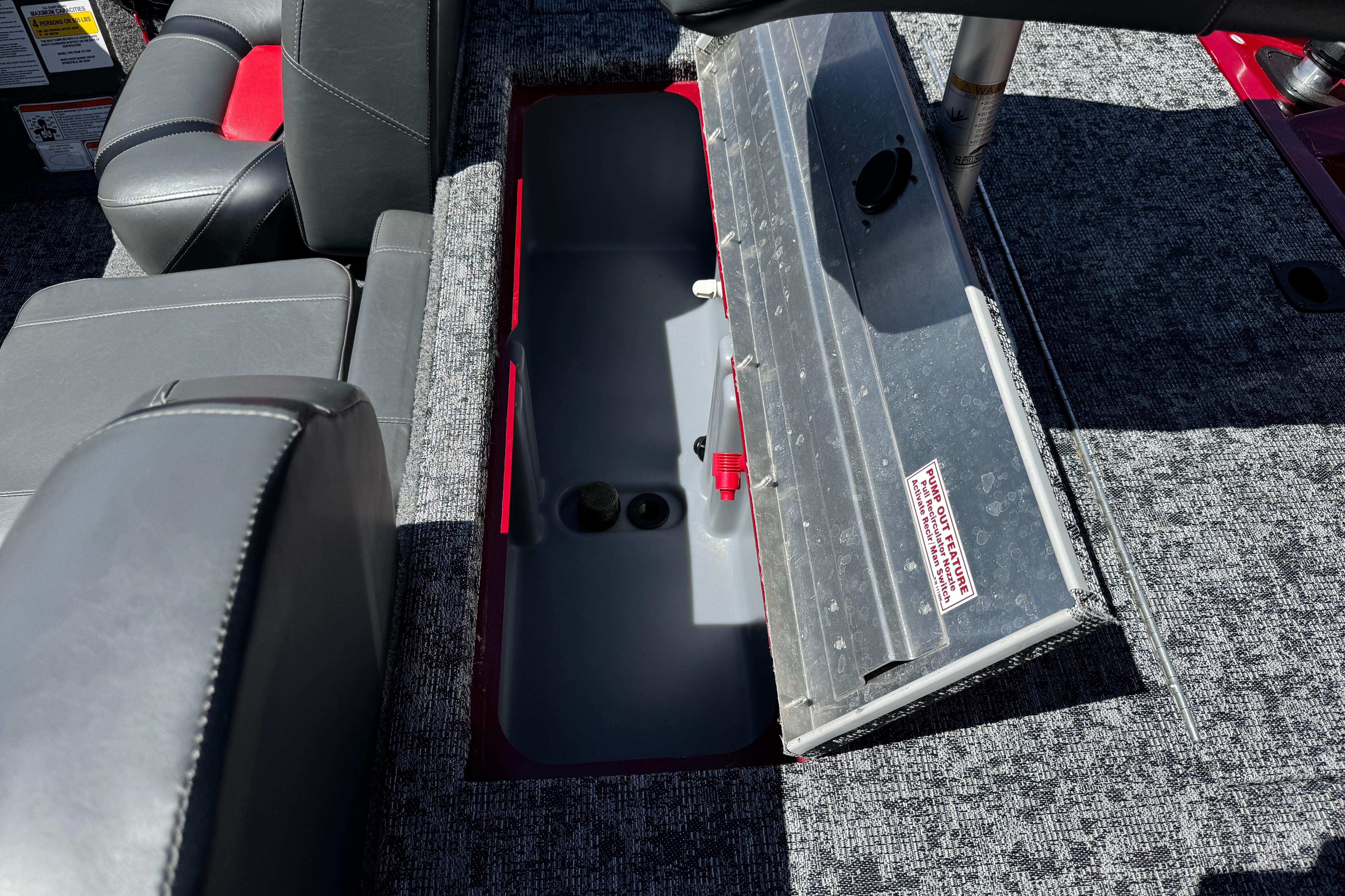 2025 Tracker Pro Team 175 TXW boat interior storage compartment with open lid.