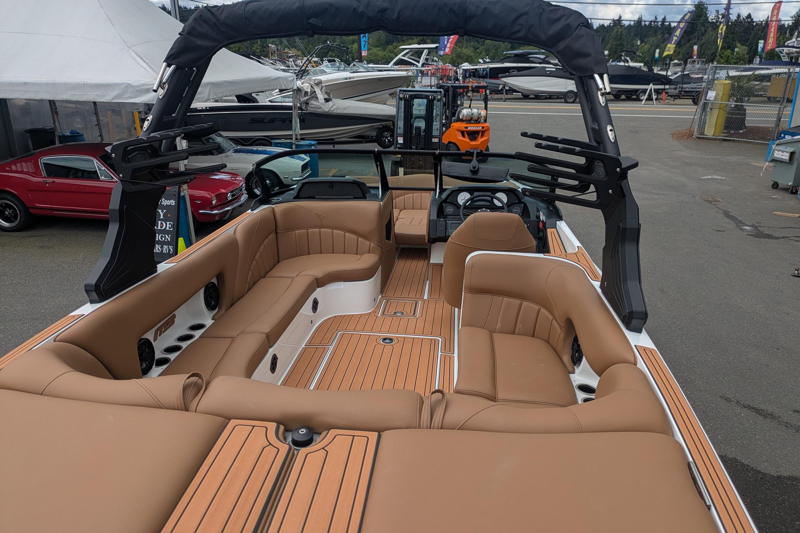 2026 MB B52-23 Classic LIMITED boat with luxurious tan seating and sleek design.
