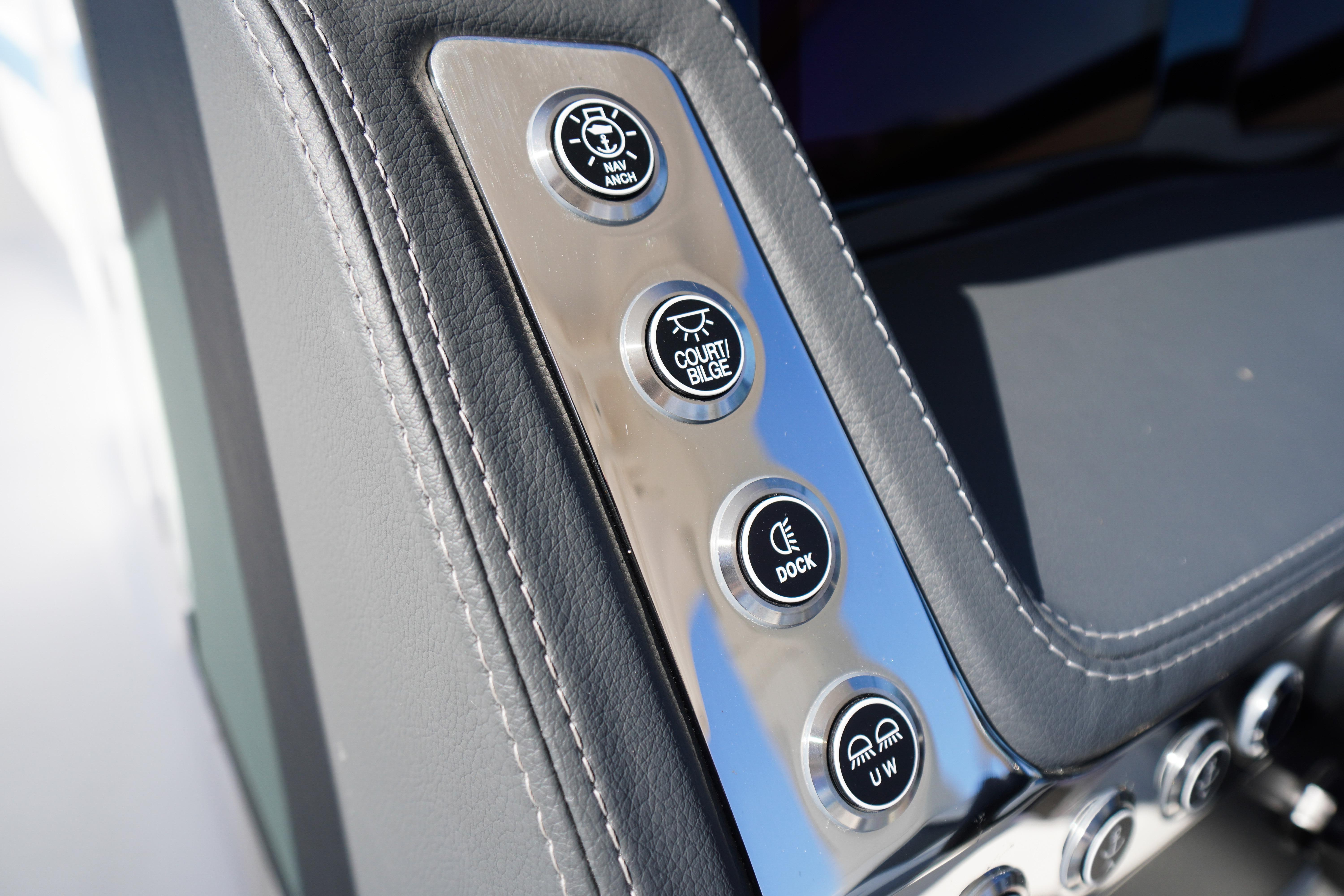 Control panel of 2026 Chaparral 270 OSX boat with various function buttons.