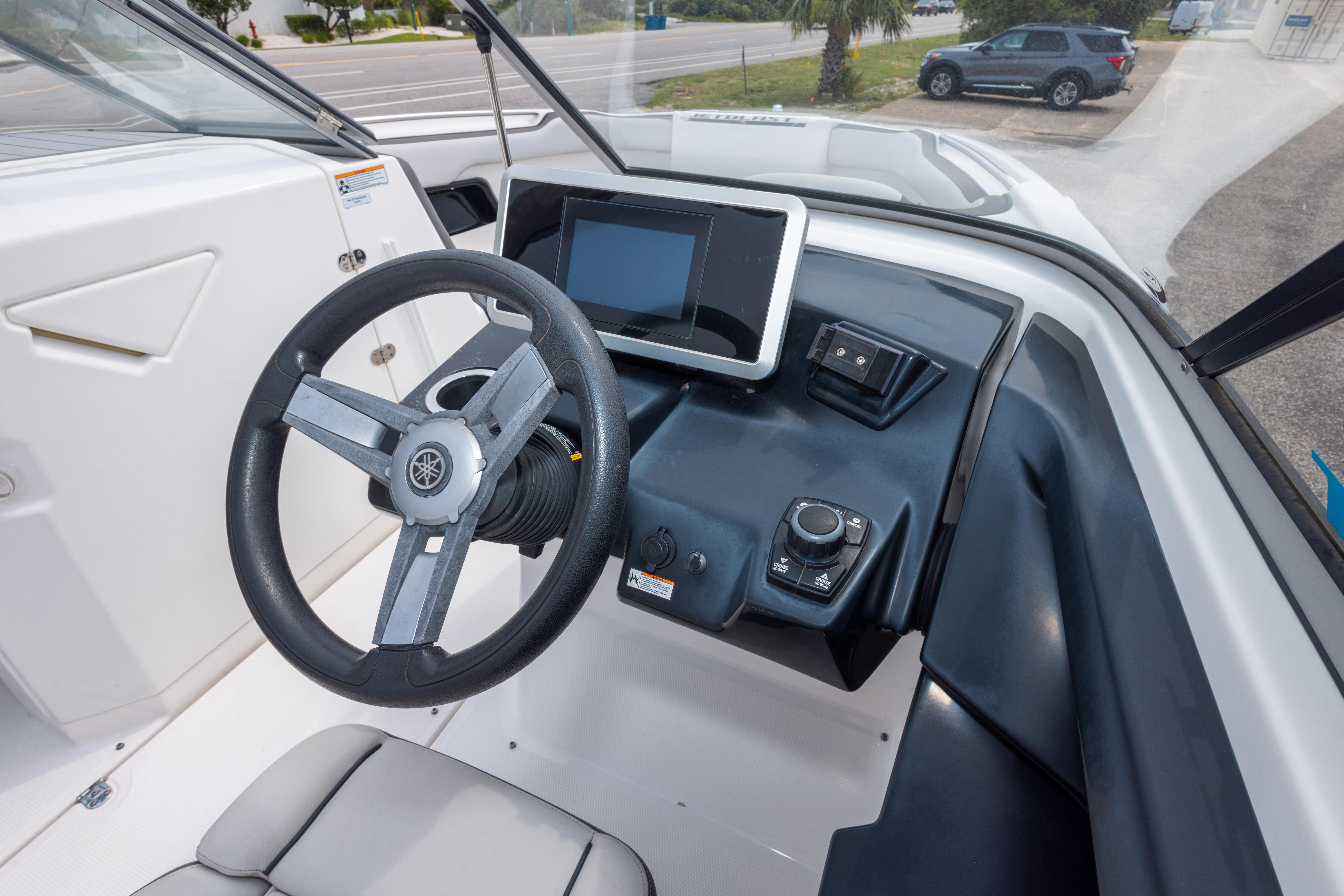 2021 Yamaha Boats AR250 dashboard with steering wheel and touchscreen display.