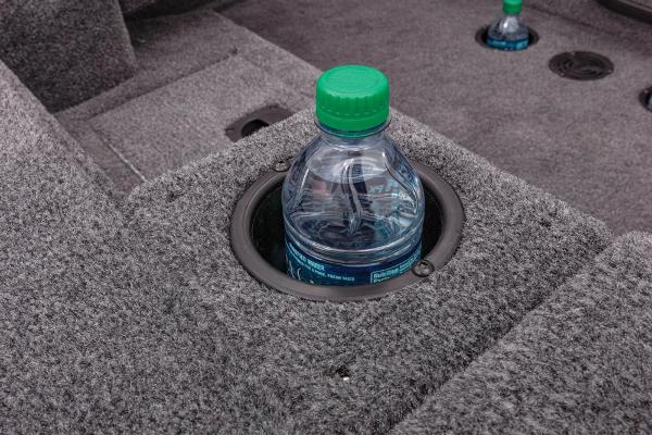 Close-up of a cup holder with a water bottle in the boat.