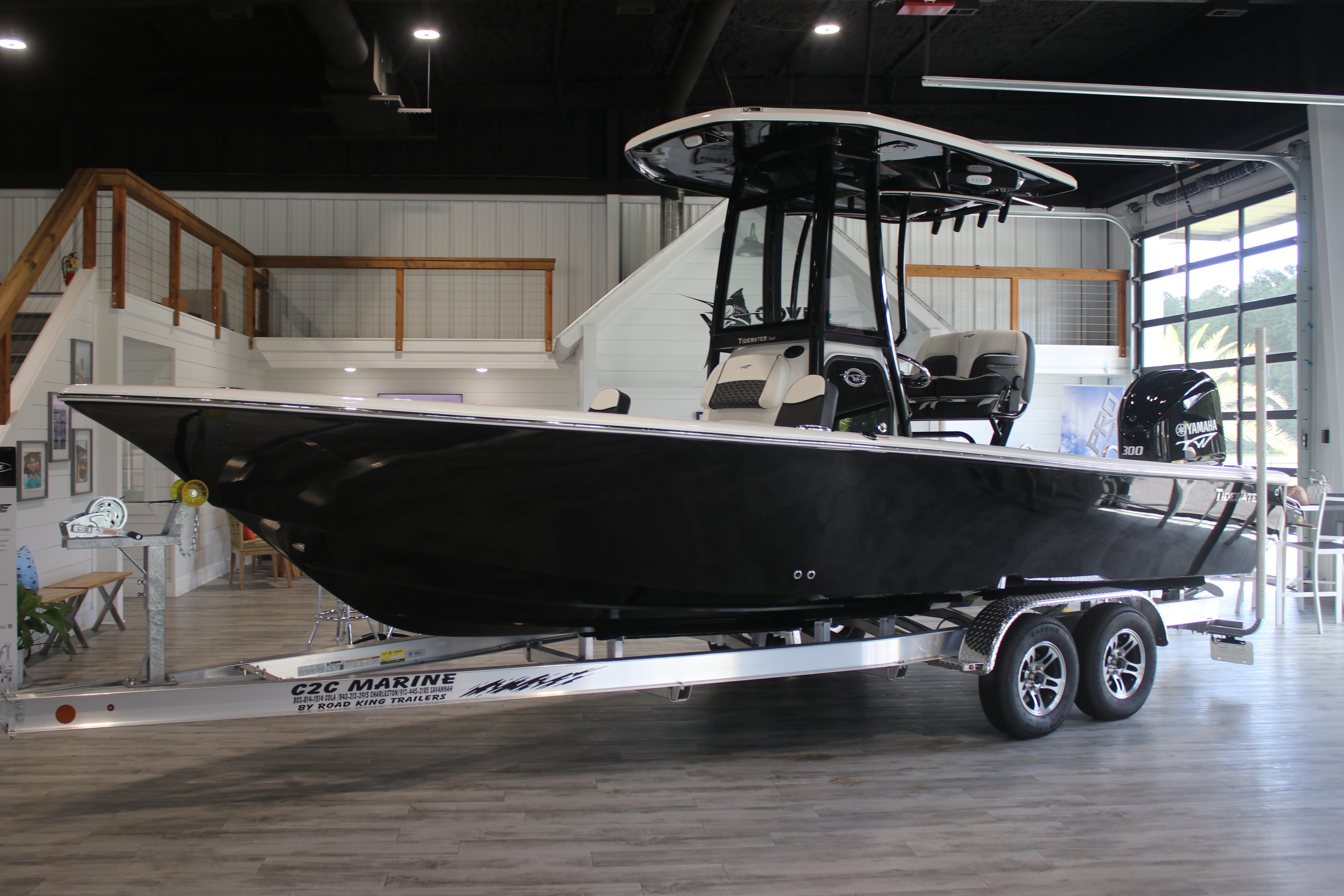 2026 Tidewater 2300 Carolina Bay boat on trailer in showroom.