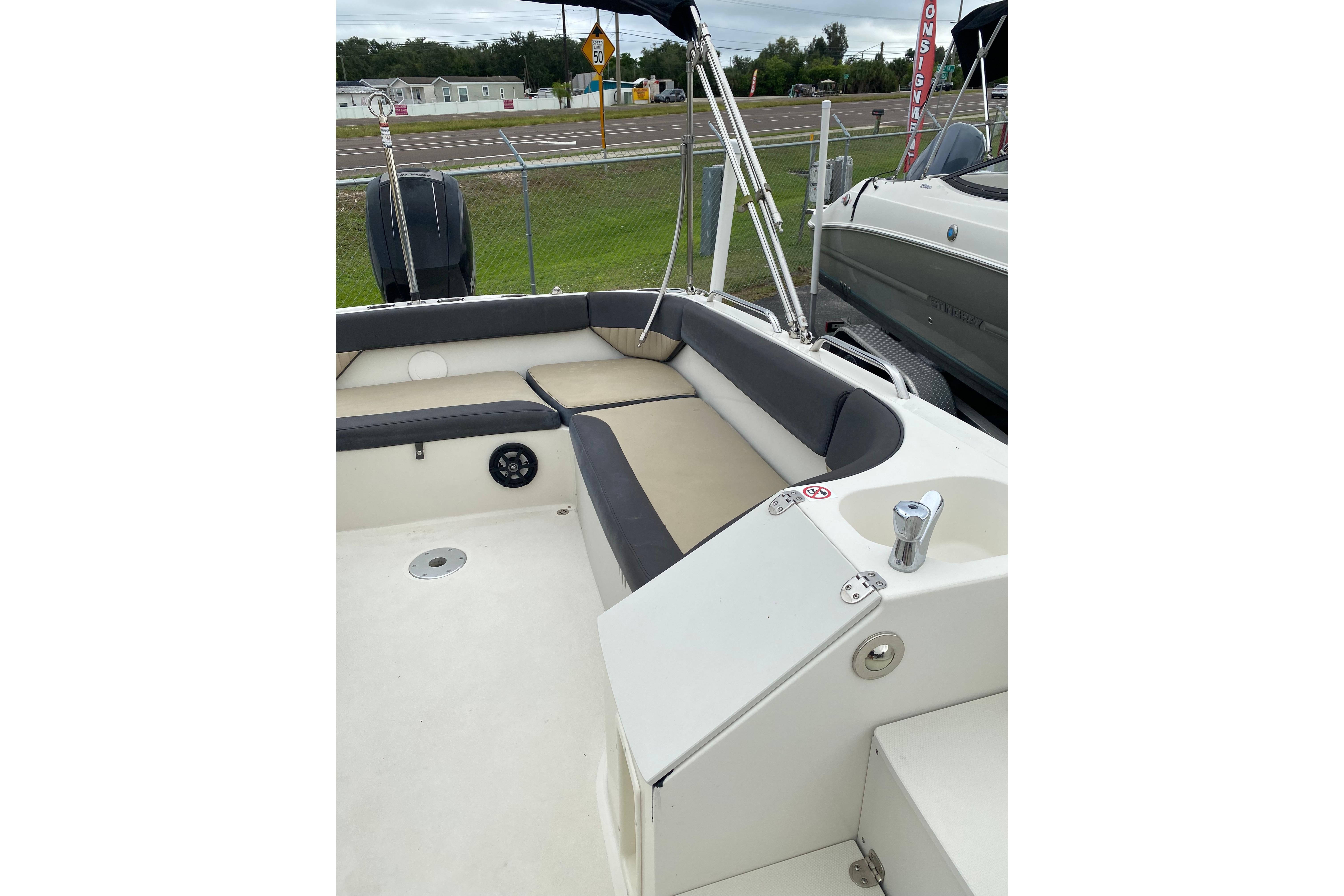 2018 Stingray 212 SC boat interior with seating and deck view.