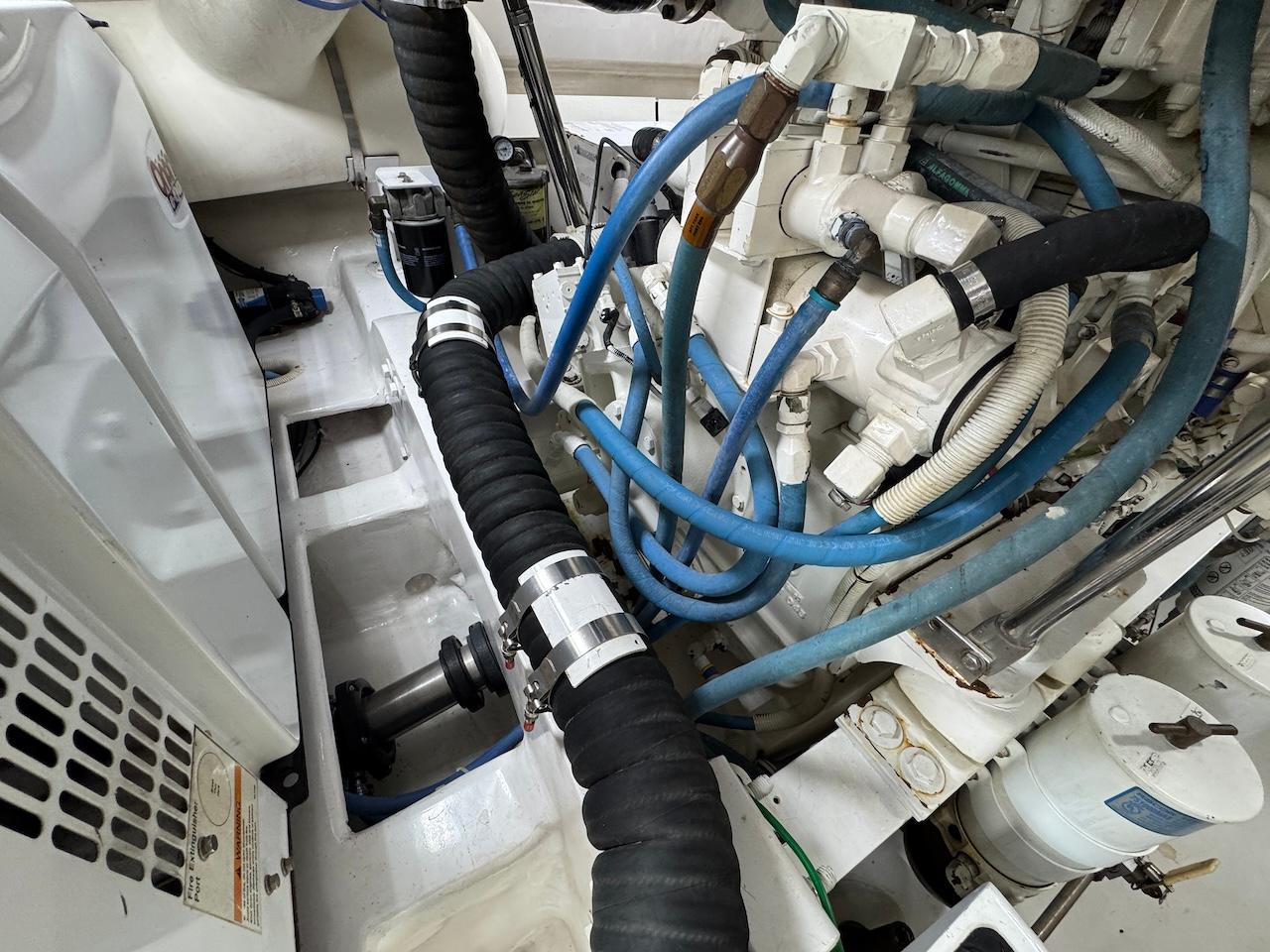 Engine room of a 2007 Viking 52 Convertibles with hoses and mechanical components.