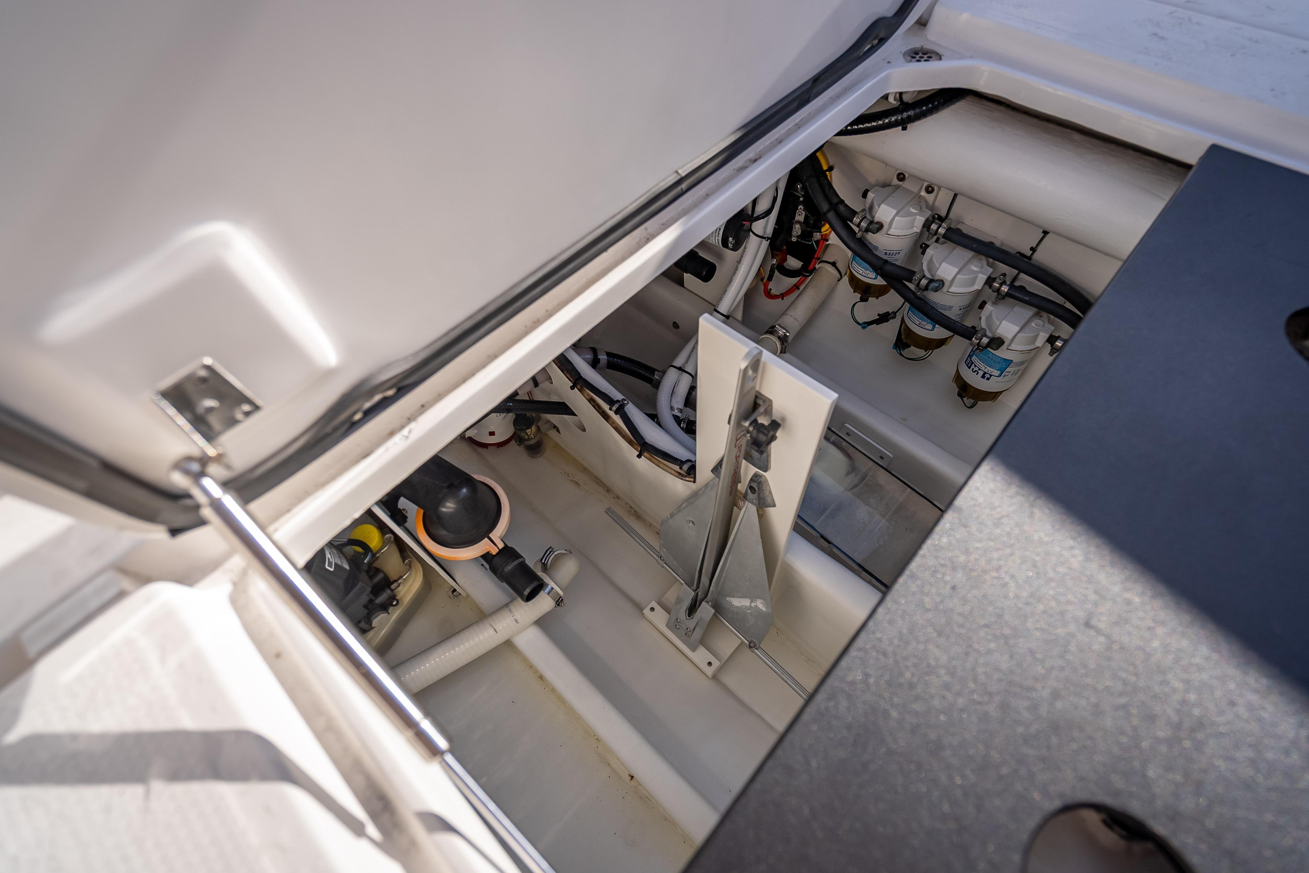 2015 Nor-Tech 340 Sport Center Console engine compartment with visible components and wiring.