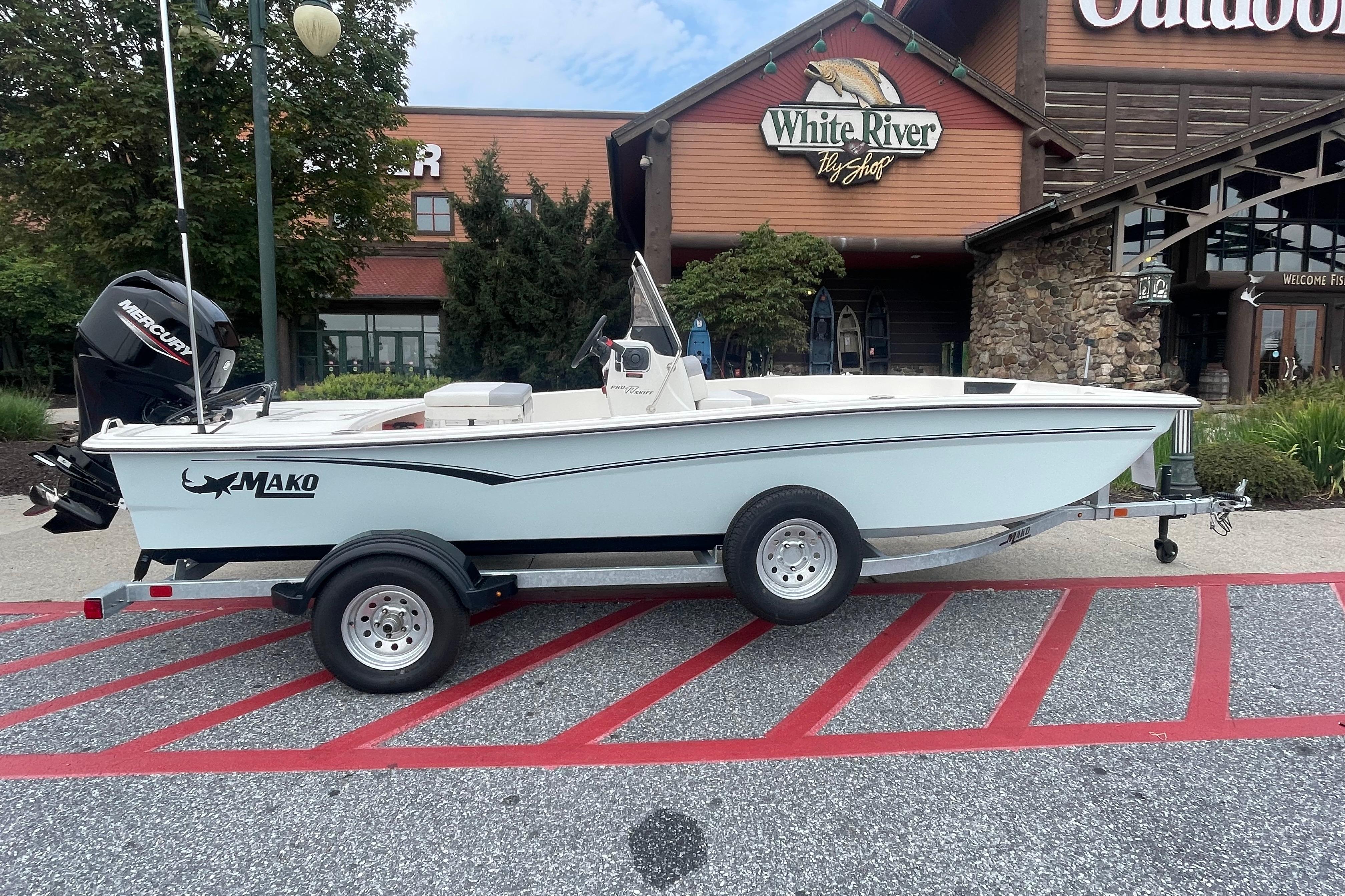 2026 Mako Pro Skiff 17 CC boat on trailer outside White River Fly Shop.