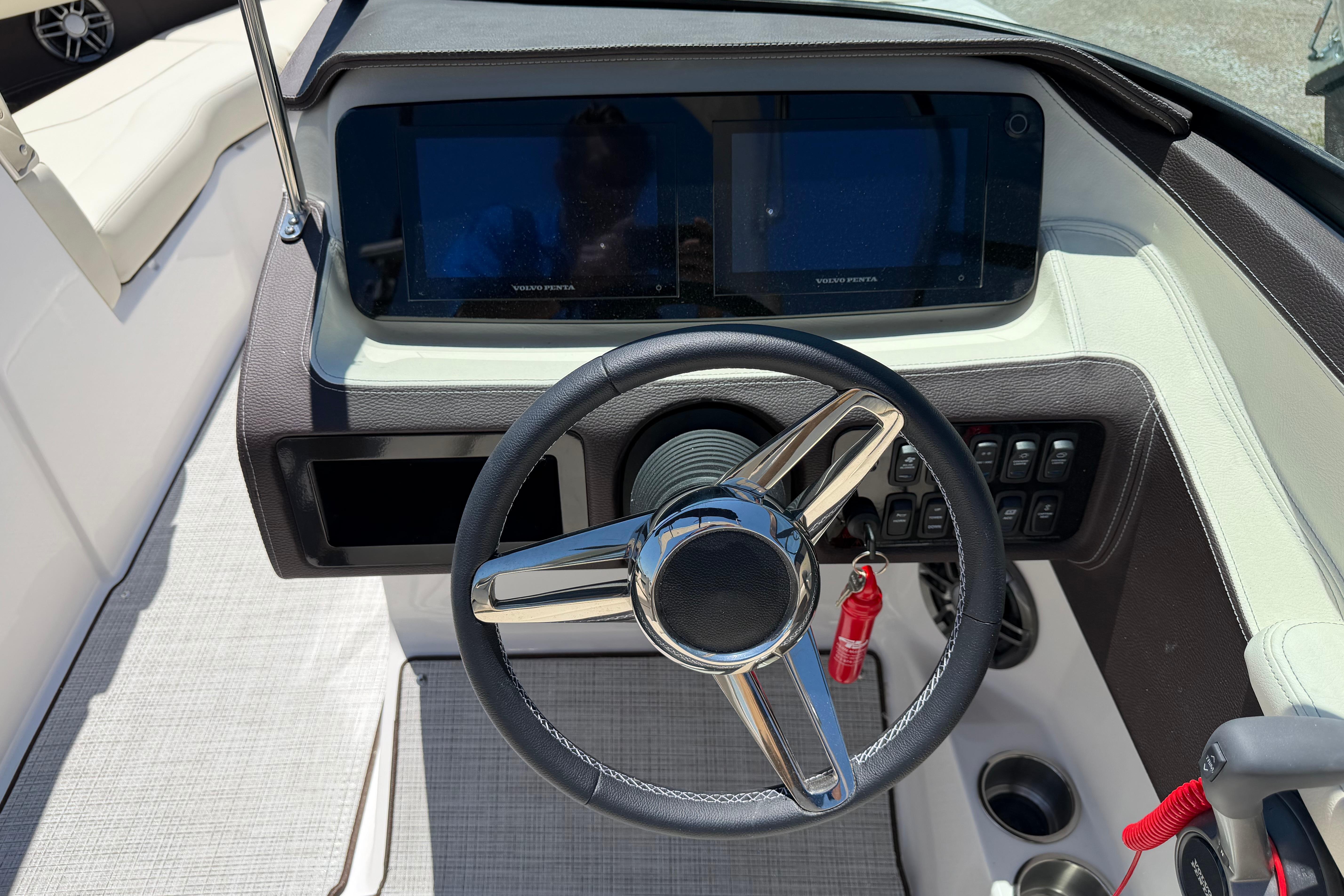 2026 Regal LS4 boat dashboard with steering wheel and digital displays.