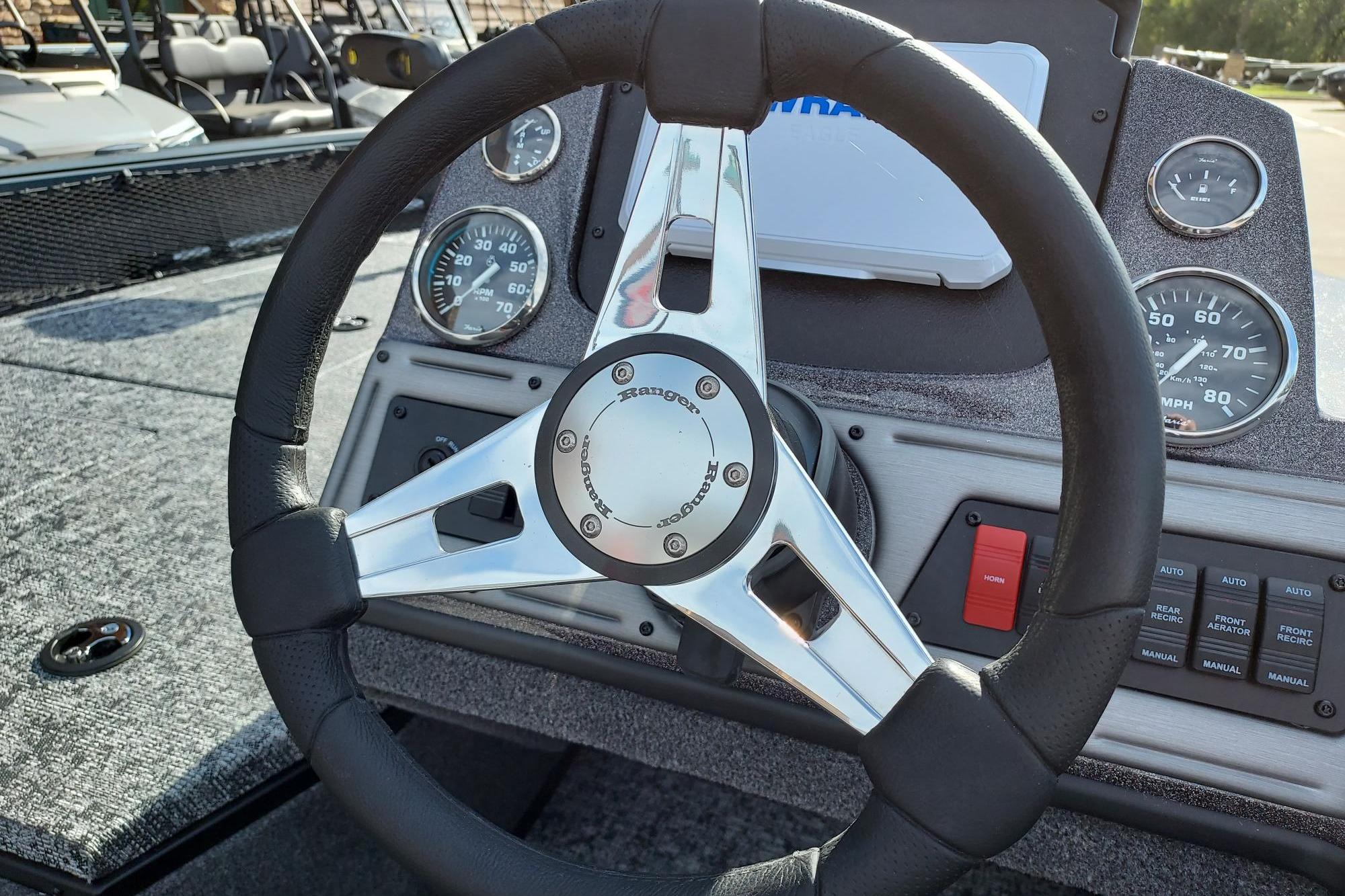 Steering wheel and dashboard of 2026 Ranger VS1782SC Angler boat, featuring gauges and controls.