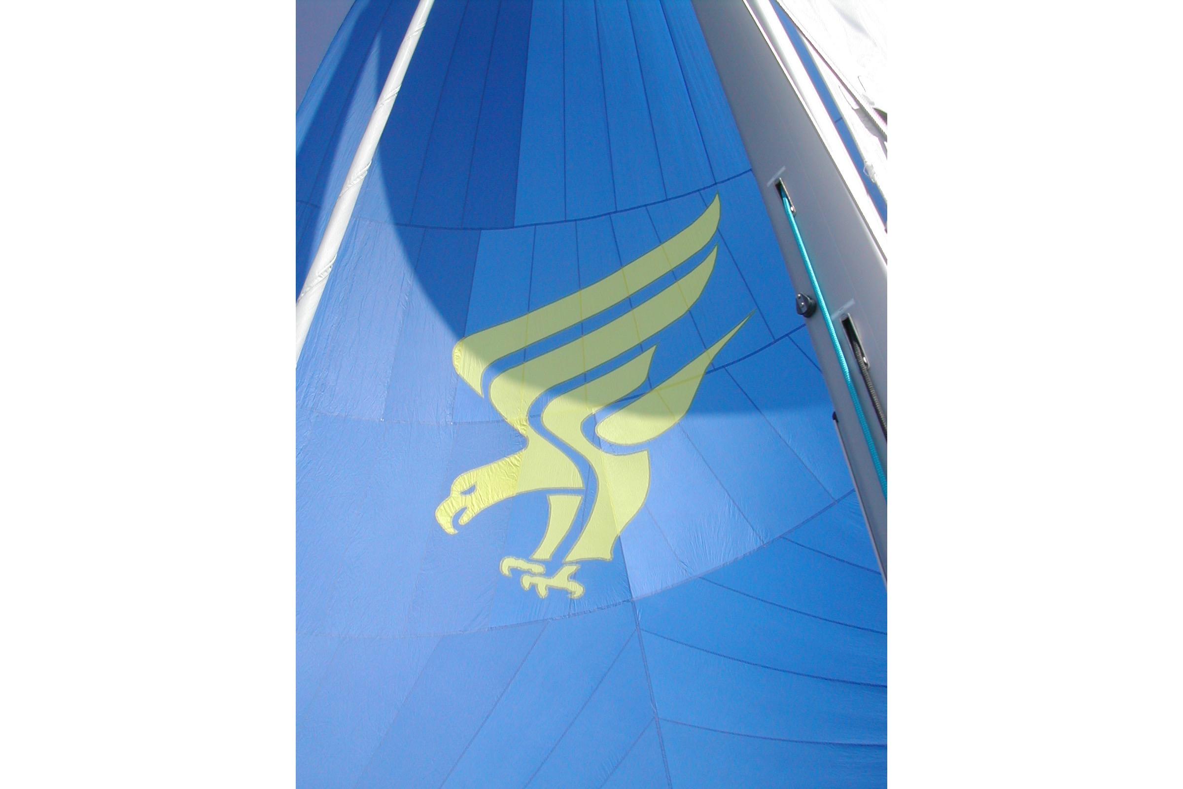 Blue sail with yellow eagle design on a 2004 Dufour 40 Performance yacht.