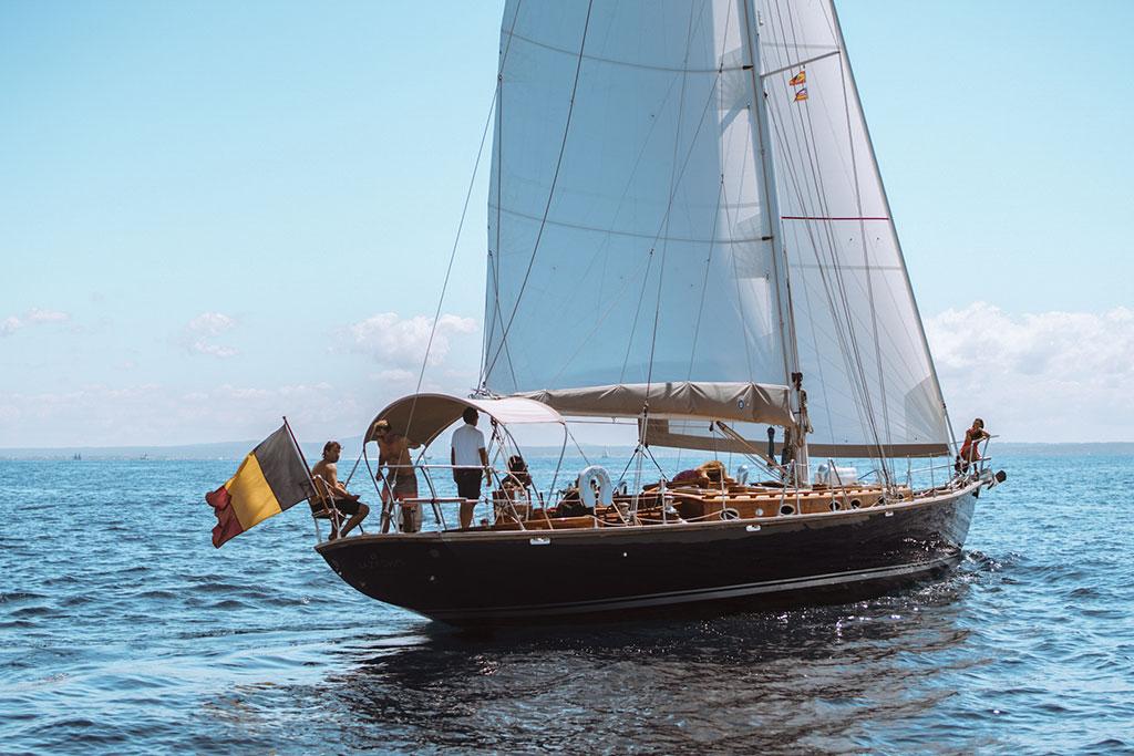 Sailing yacht Joubert-Nivelt TM 52, 2004 model, cruising on open sea with Belgian flag.