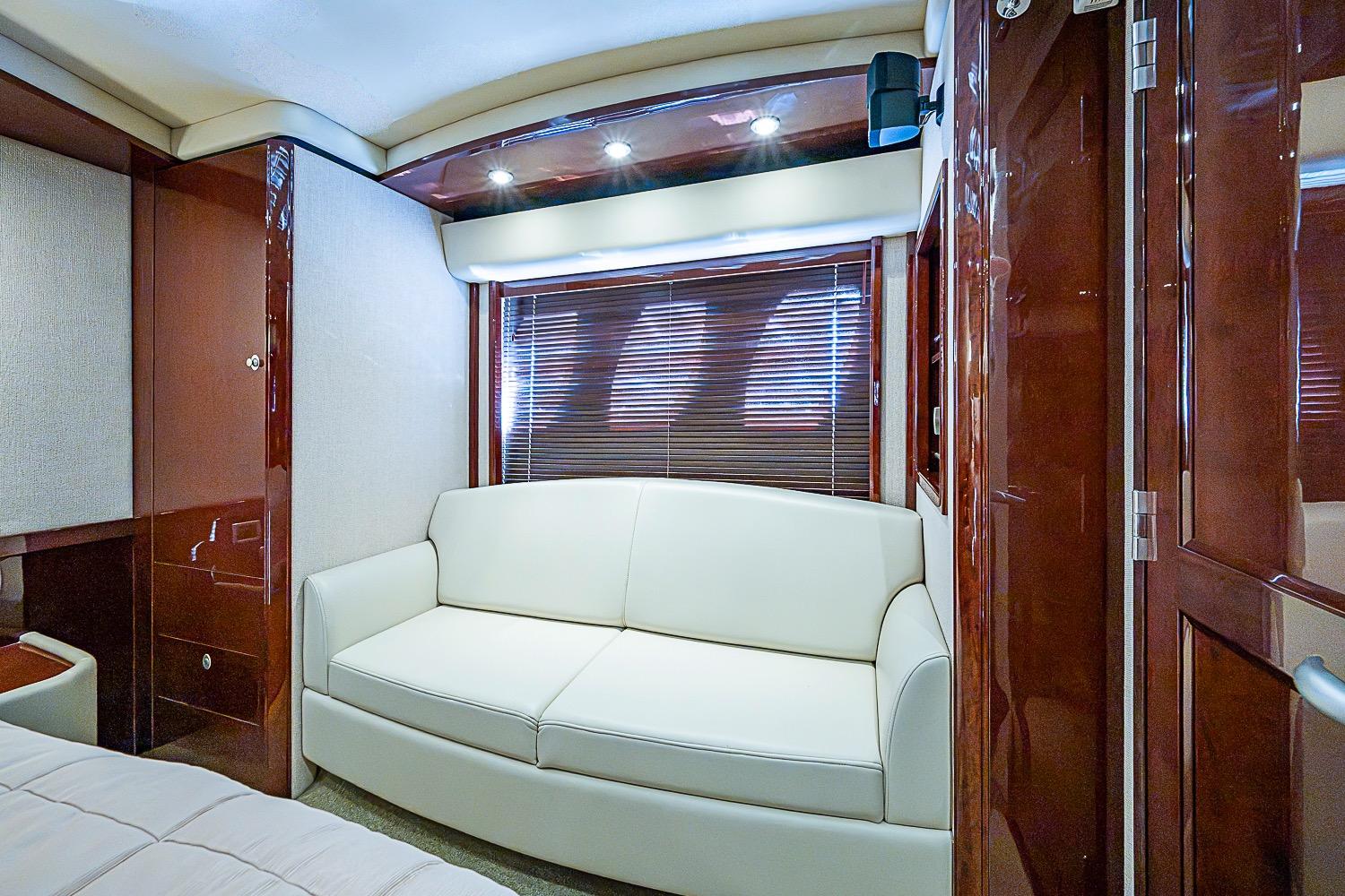 Luxurious interior of 2008 Sea Ray 60 Sundancer yacht with elegant white sofa.