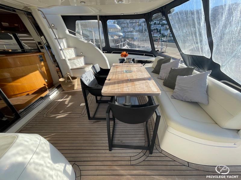 Luxurious Sunseeker Manhattan 74 yacht interior with elegant seating and dining area, 2001 model.