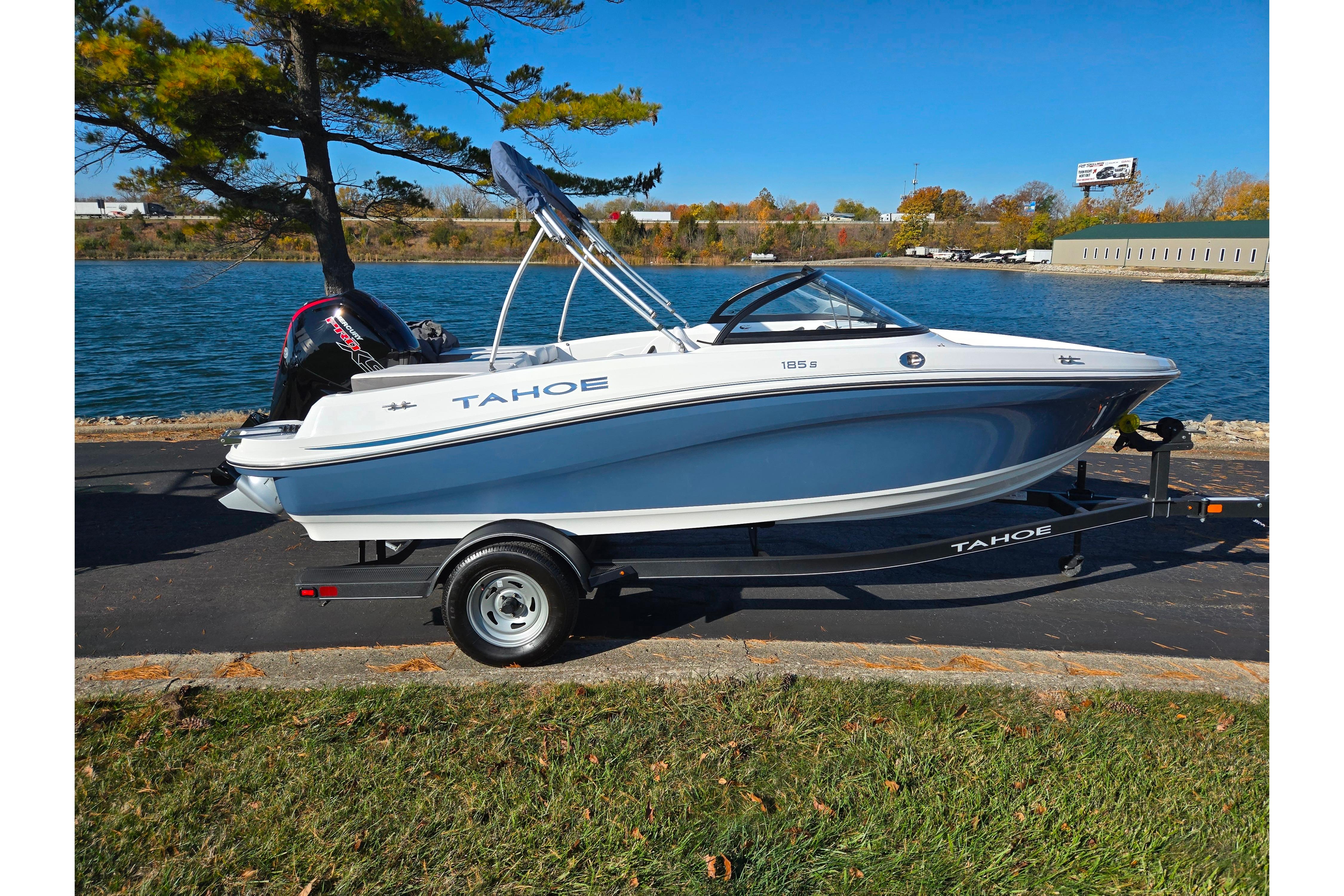 2023 Tahoe 185 S boat on trailer by a scenic waterfront.
