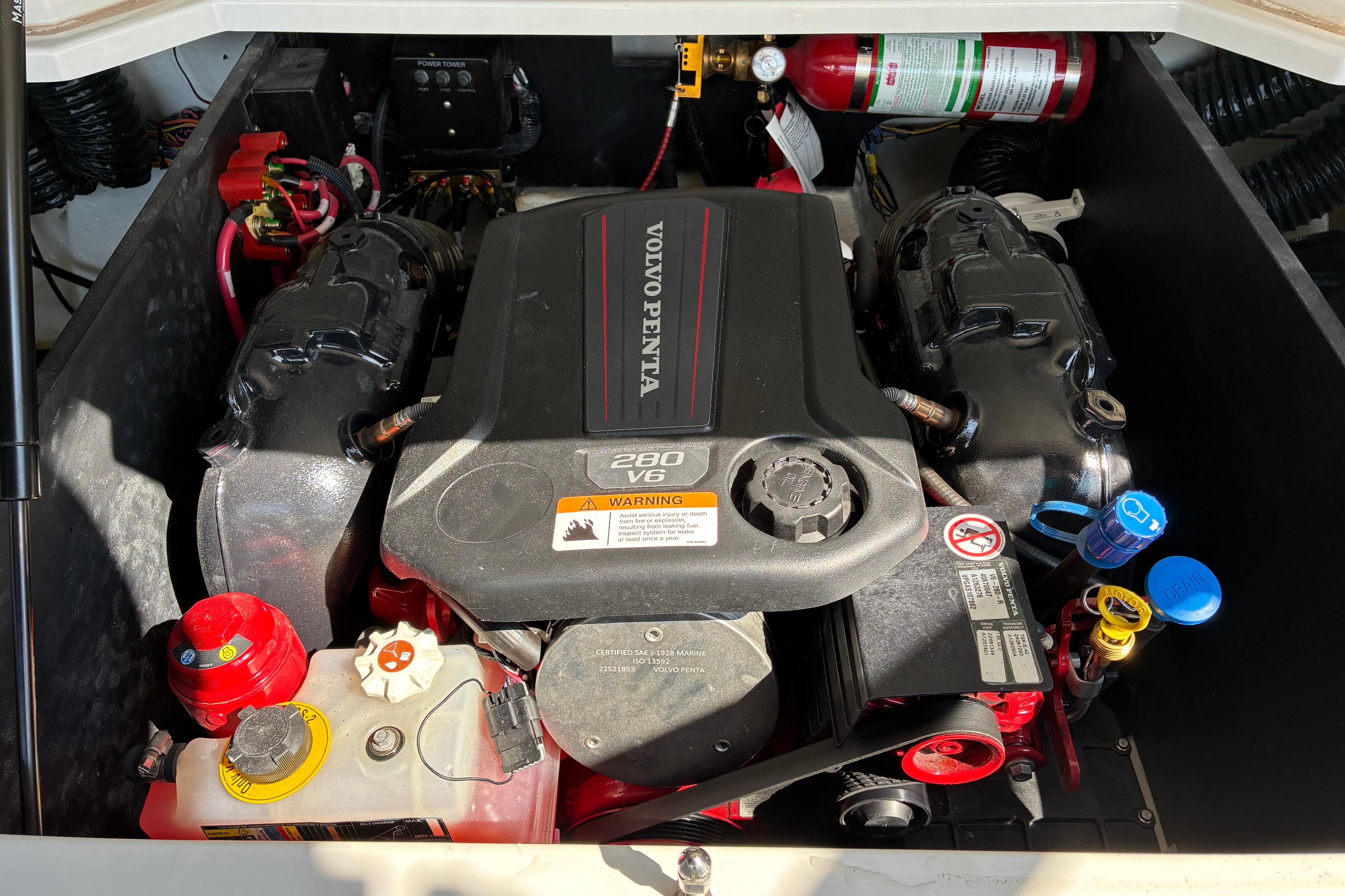 Engine compartment of a 2025 Regal LS2 boat featuring a Volvo Penta 280 V6 engine.