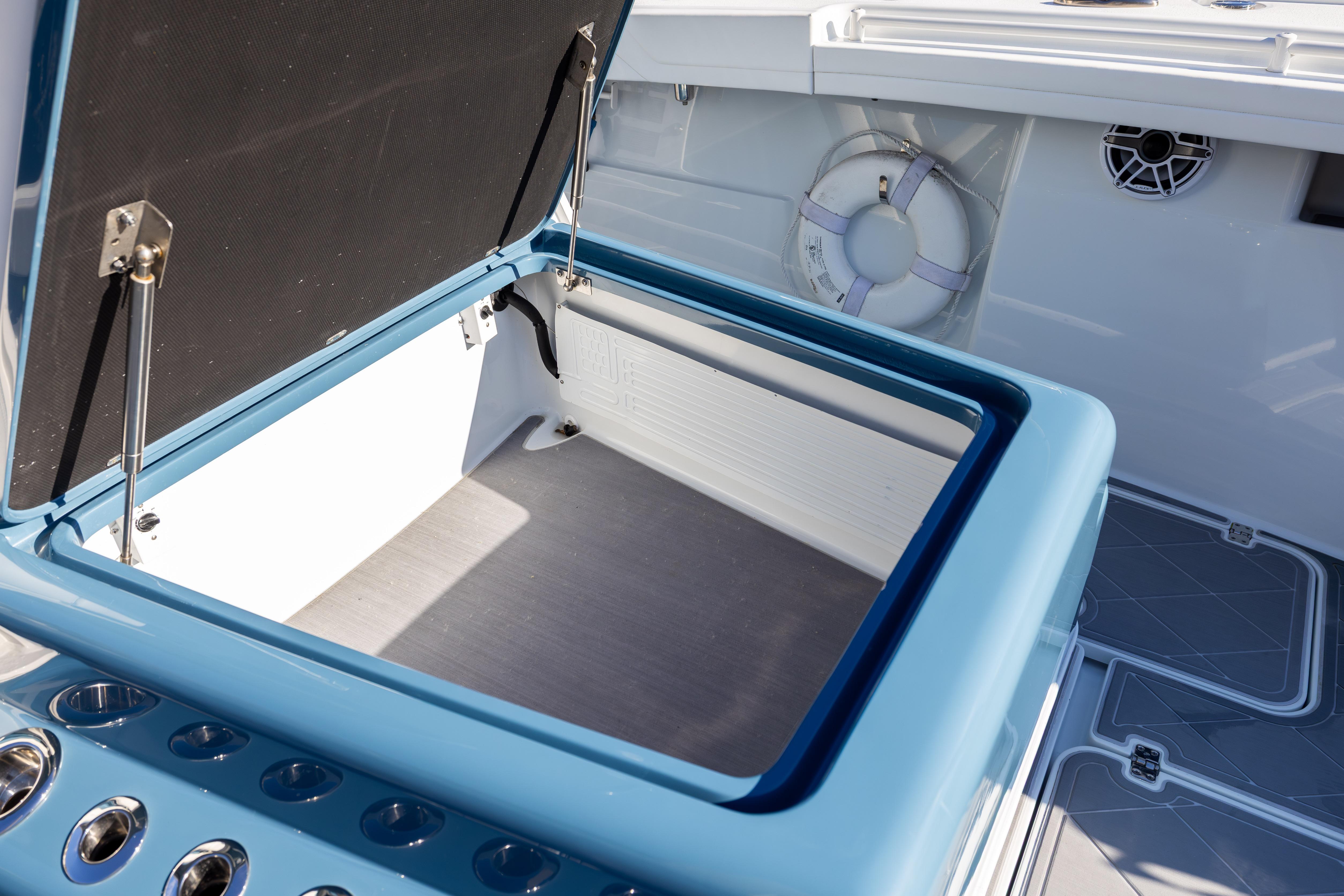 2024 Yellowfin 42 Offshore boat with open storage compartment and life preserver.