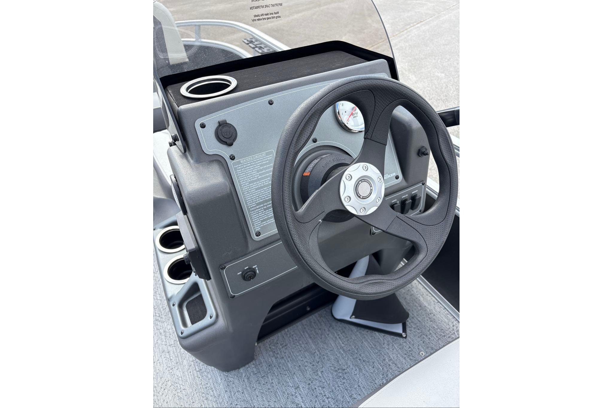 Steering console of 2026 Sun Tracker Bass Buggy 16 XL Select pontoon boat.