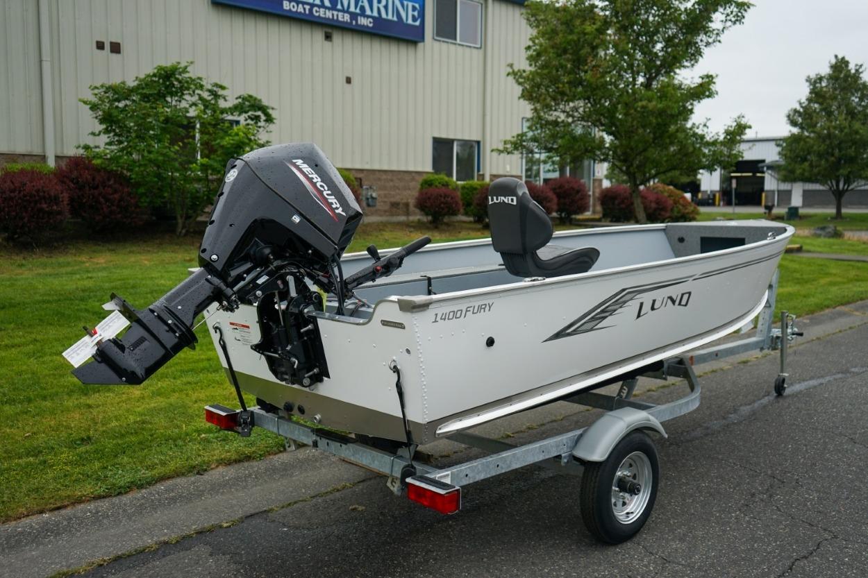 2026 Lund 1400 Fury Tiller boat on trailer, featuring Mercury outboard motor.