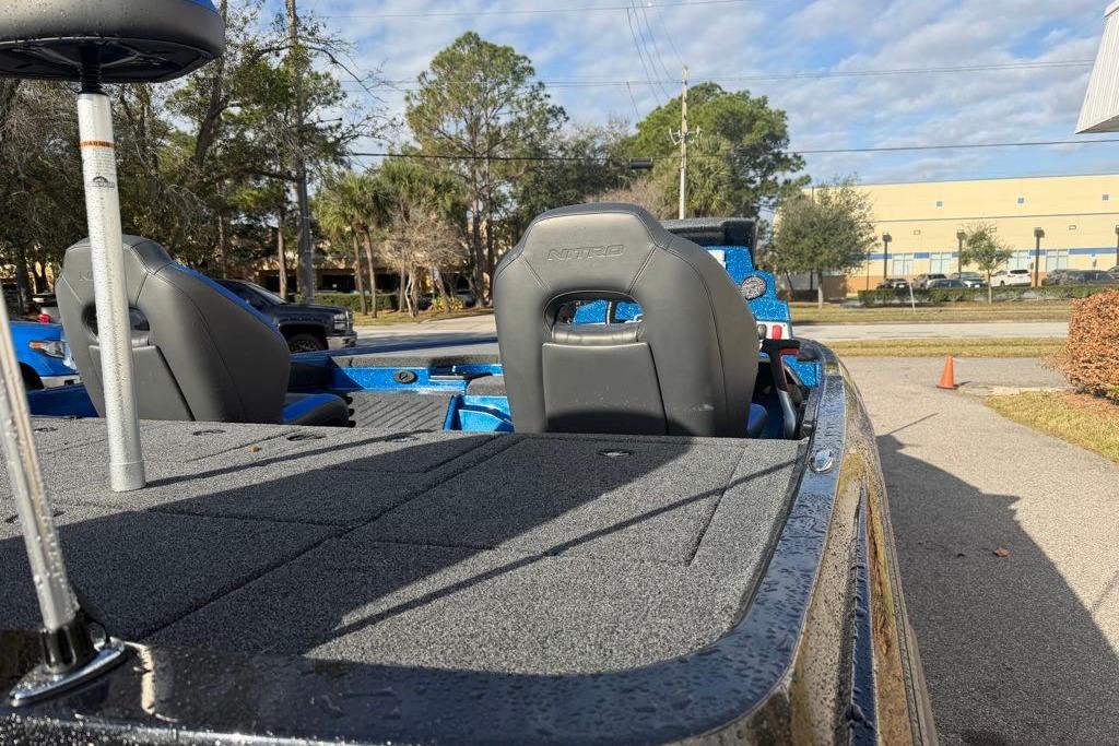 2026 Nitro Z19 XL Pro boat with gray seating and blue interior, parked outdoors.