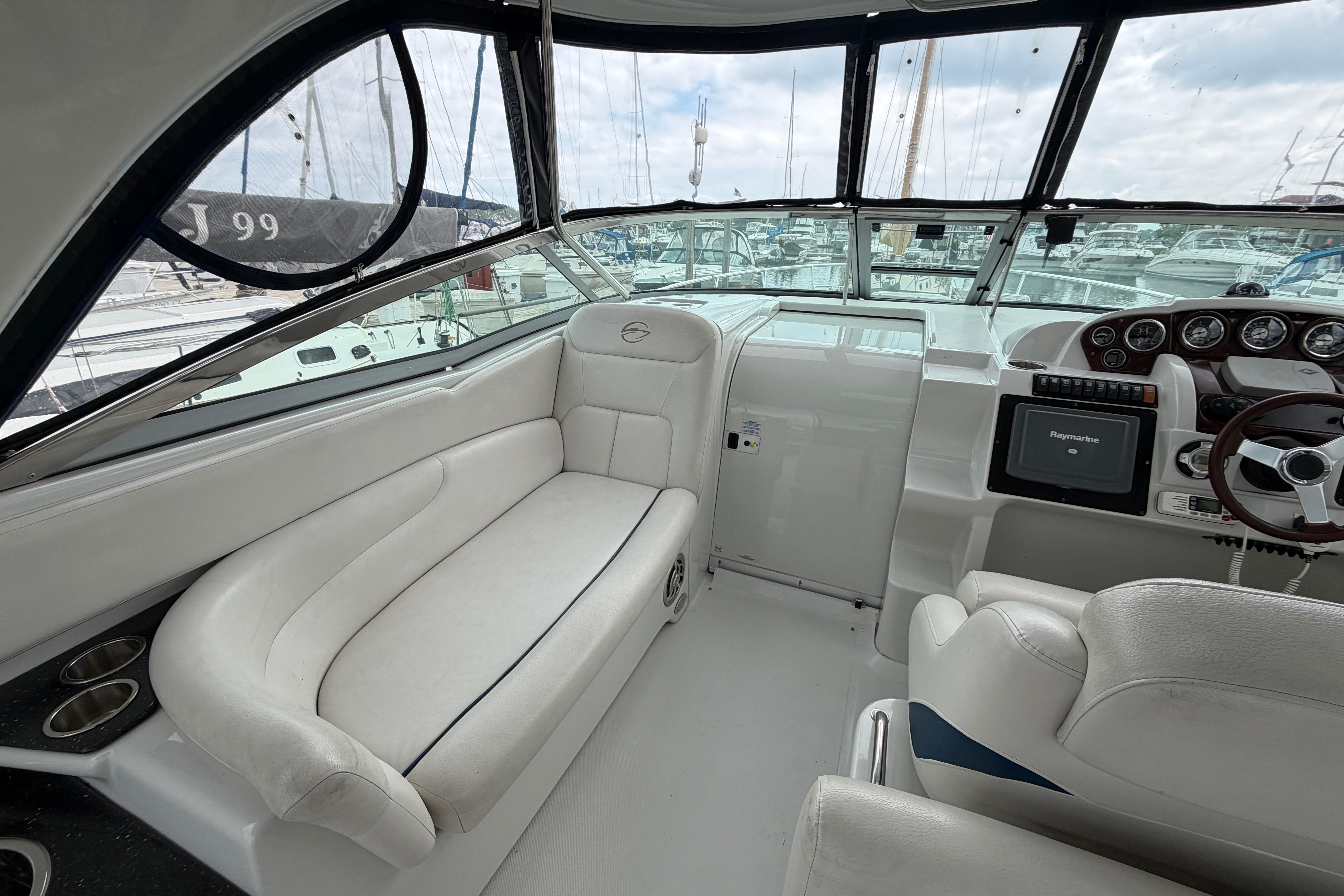 2008 Crownline 340 CR boat interior with plush seating and modern dashboard.