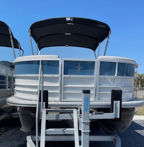 2025 Berkshire 22 RFX LE Tri-toon Pontoon with canopy, displayed on a trailer.