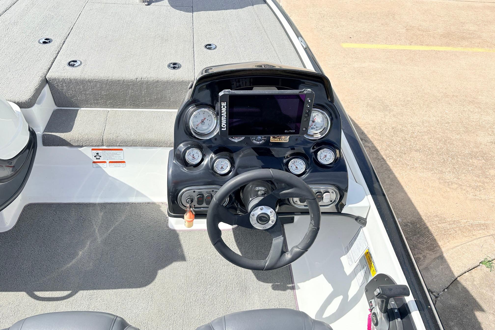 Steering console of a 2011 Nitro Z-7 boat with gauges and navigation system.