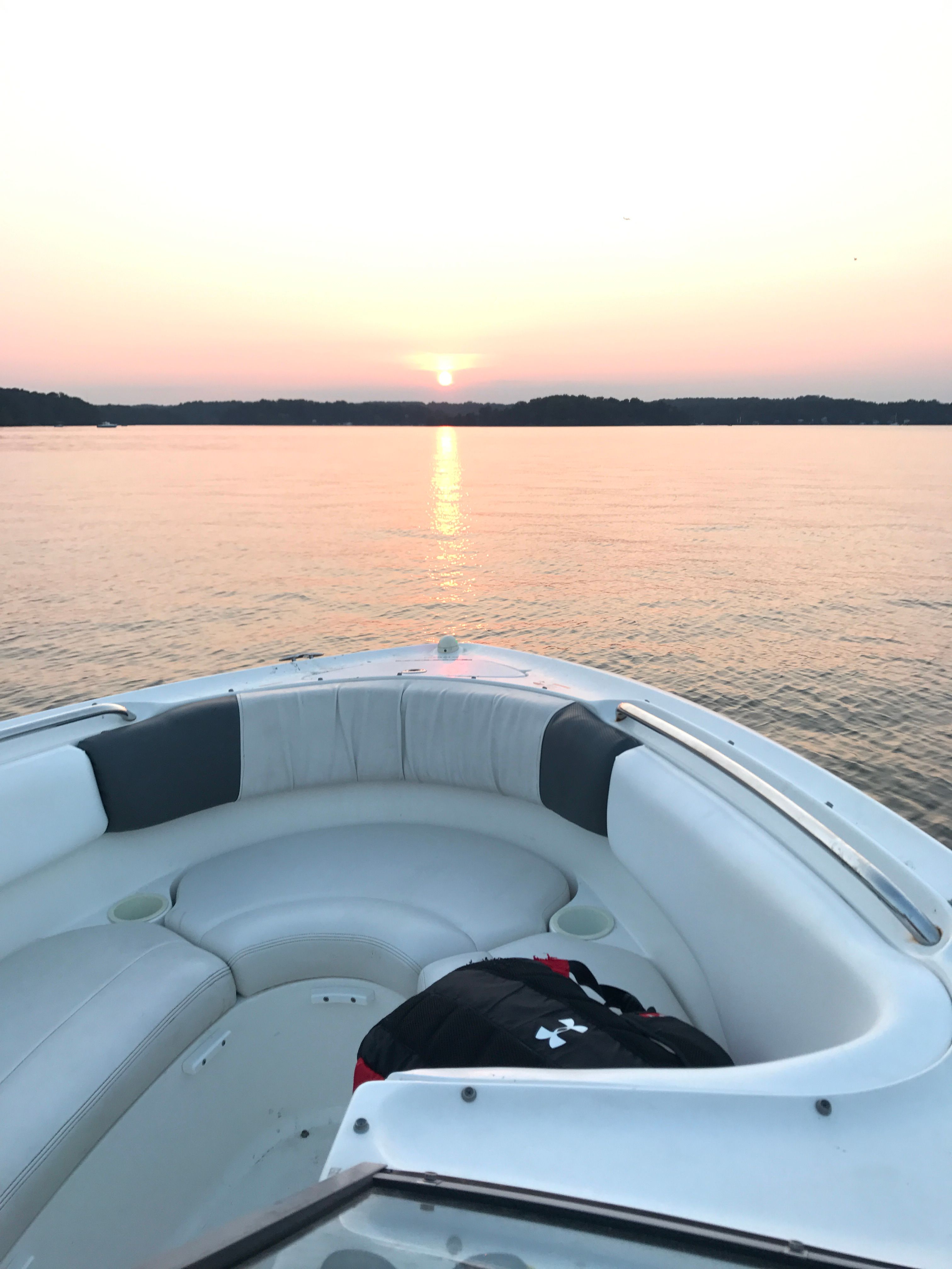 Yamaha SX230 HO boat at sunset on calm waters, 2005 model.
