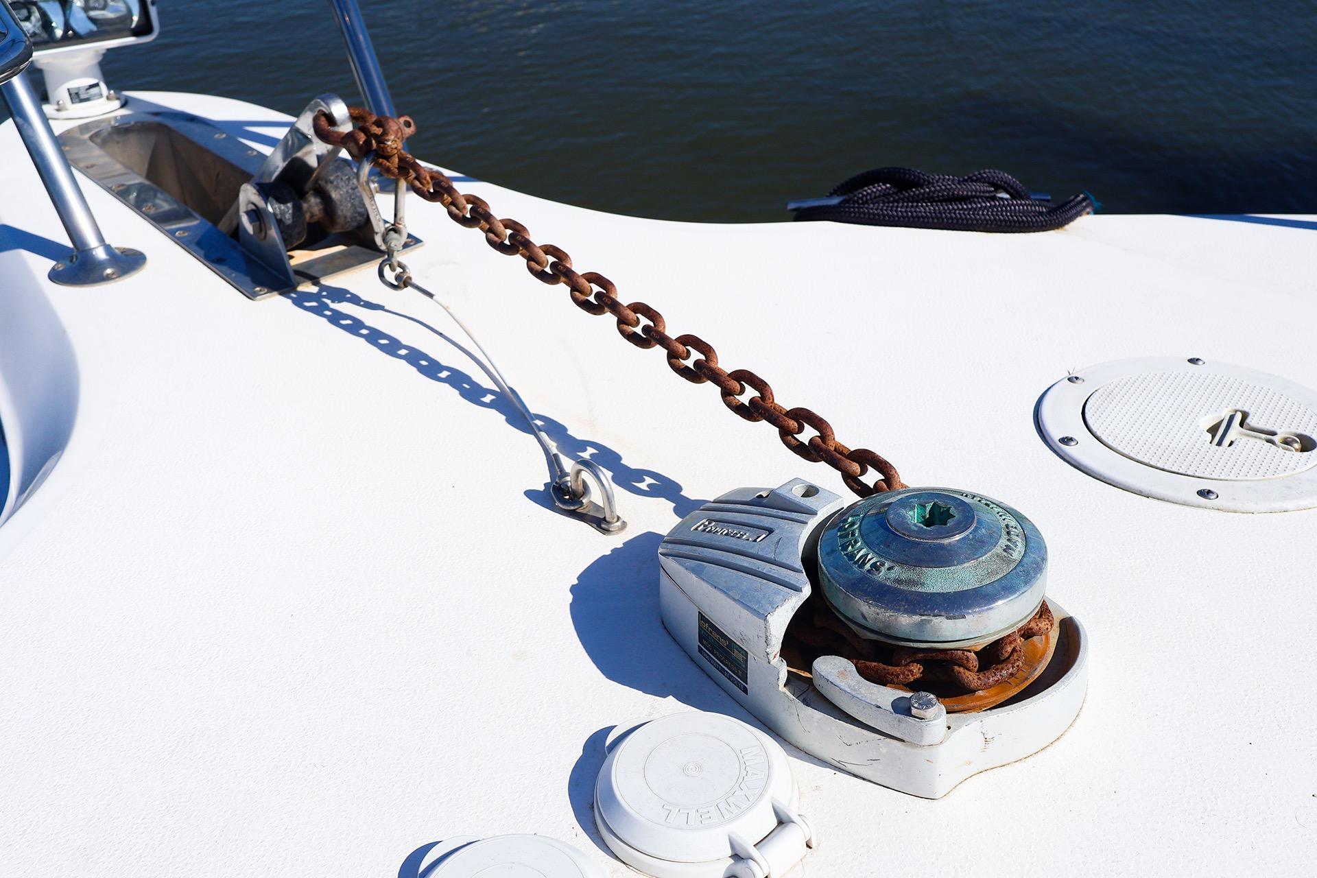 Anchor chain and windlass on 1998 Sea Ray 500 Sundancer boat deck.