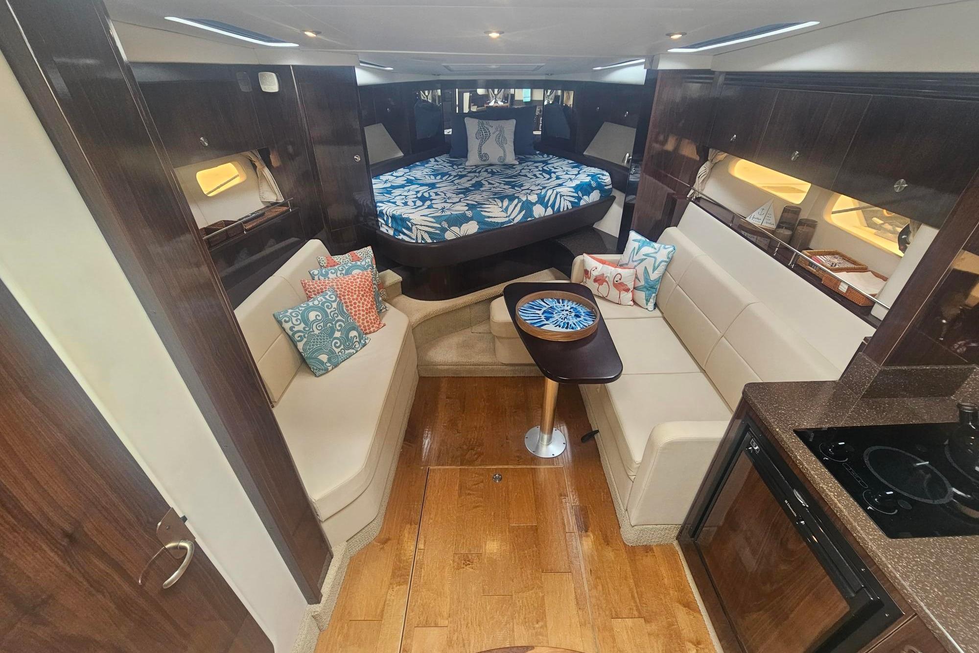 Luxurious interior of 2016 Sea Ray Sundancer 350 yacht with elegant seating and modern amenities.