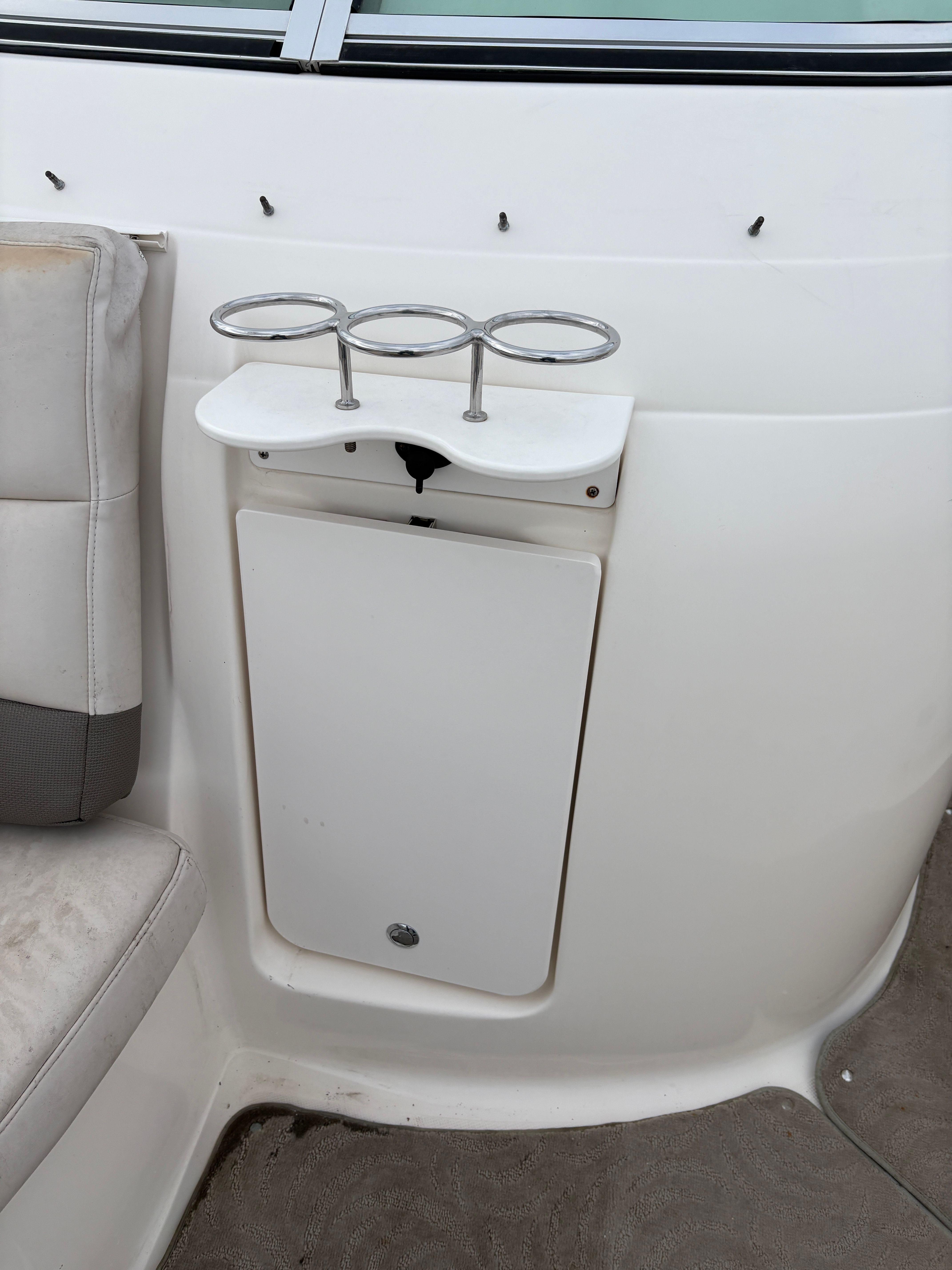 Interior of a 2009 Hurricane SUN DECK 260 boat with cup holders.