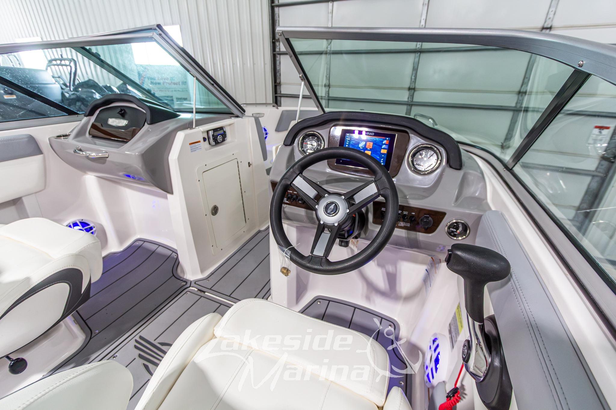 Interior view of 2022 Chaparral 21 SSi boat with modern dashboard and steering wheel.