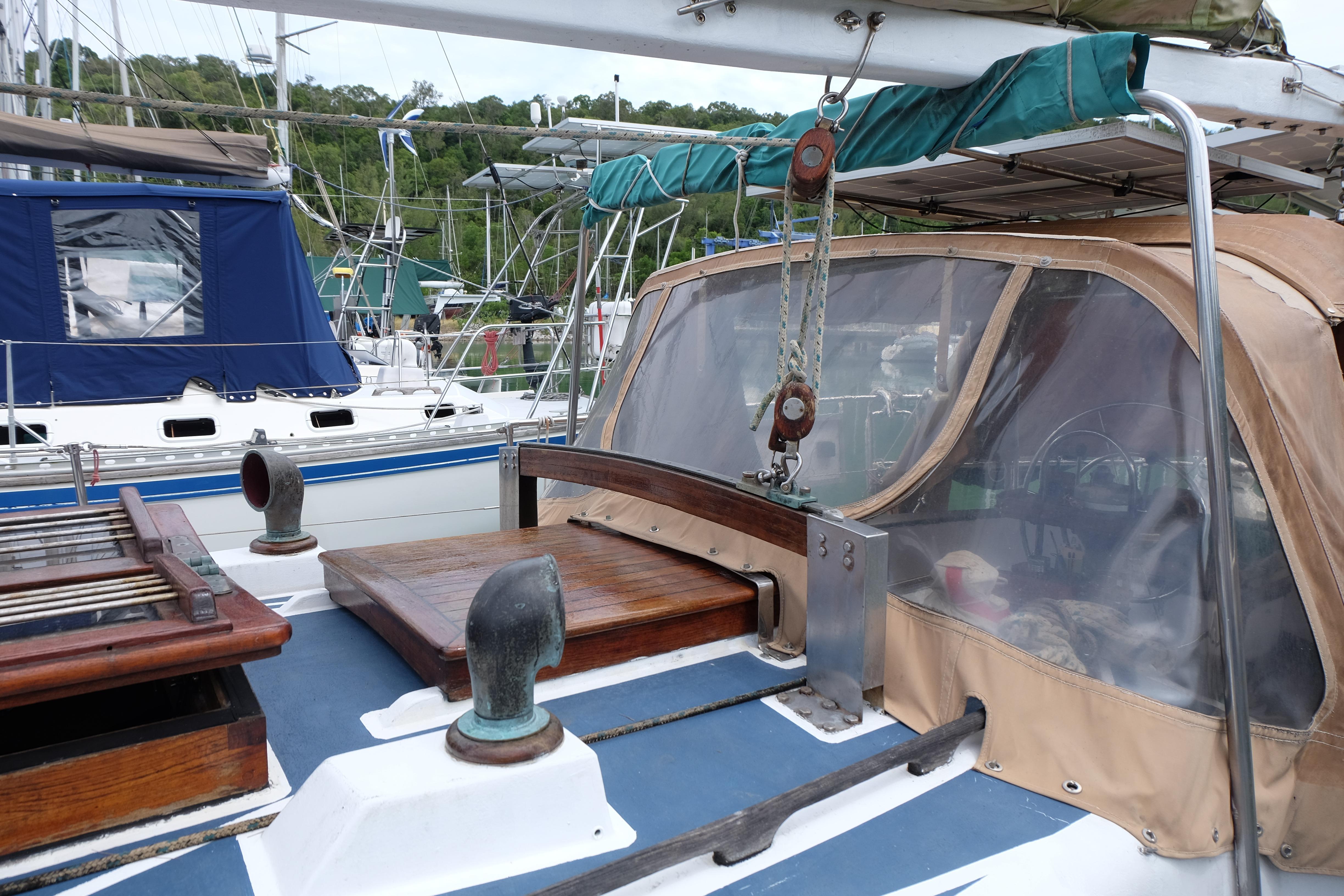 1979 Westwind 35 sailboat cockpit with wooden details and protective canopy.