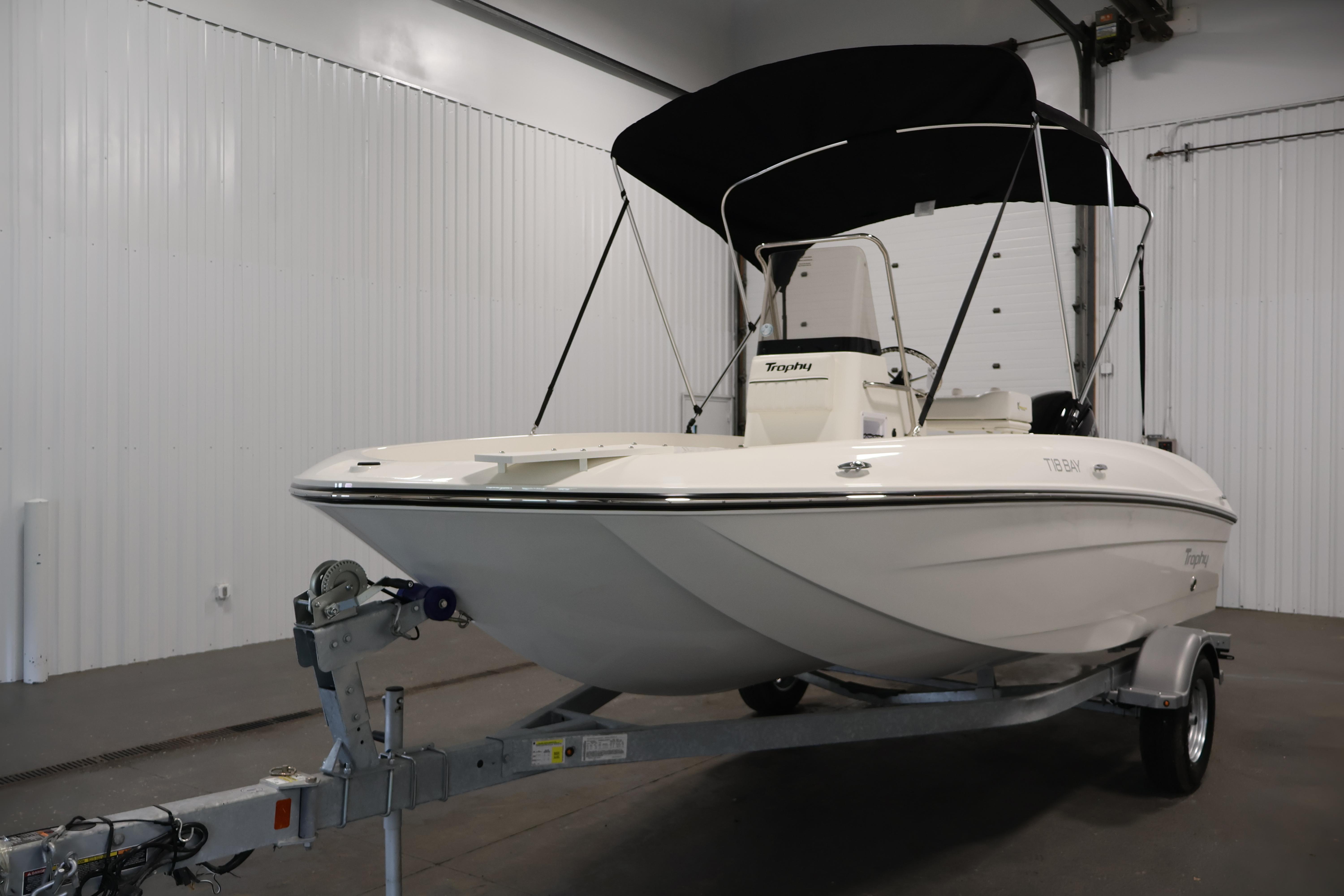 2026 Bayliner Trophy T18 boat on trailer in indoor storage facility.