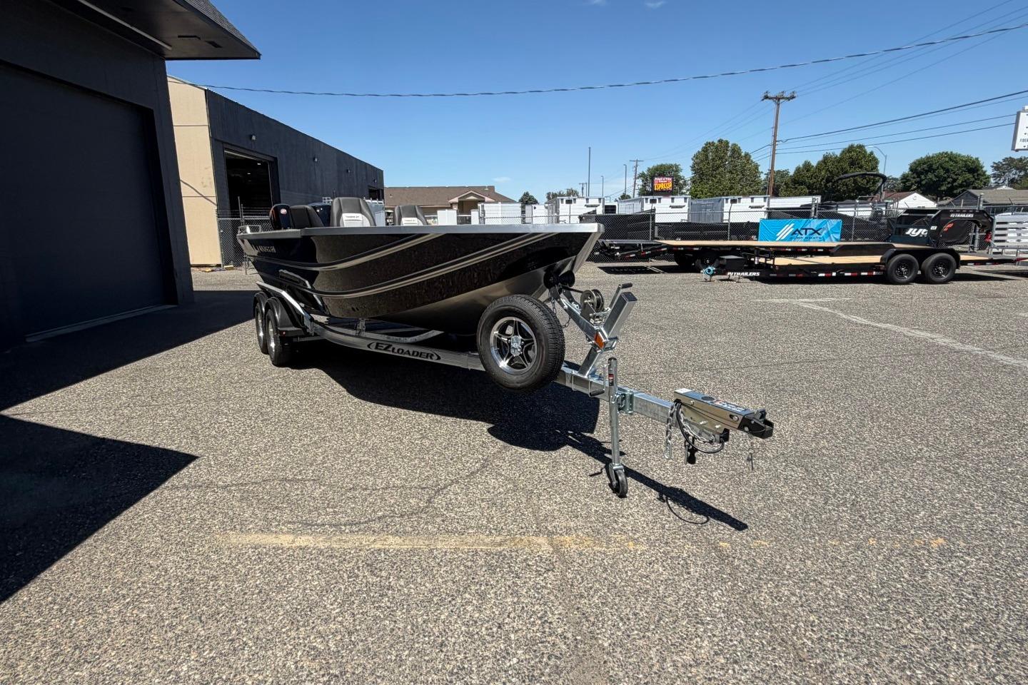 2026 Thunder Jet 209 Rush OT boat on trailer in parking lot, sunny day.
