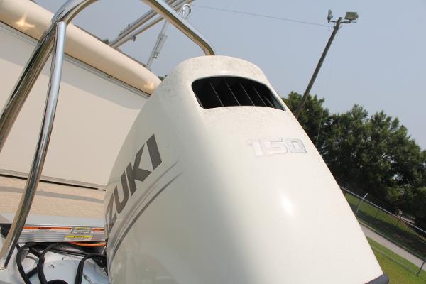 Outboard motor on 2021 Tahoe LTZ Cruise boat, featuring Suzuki branding.