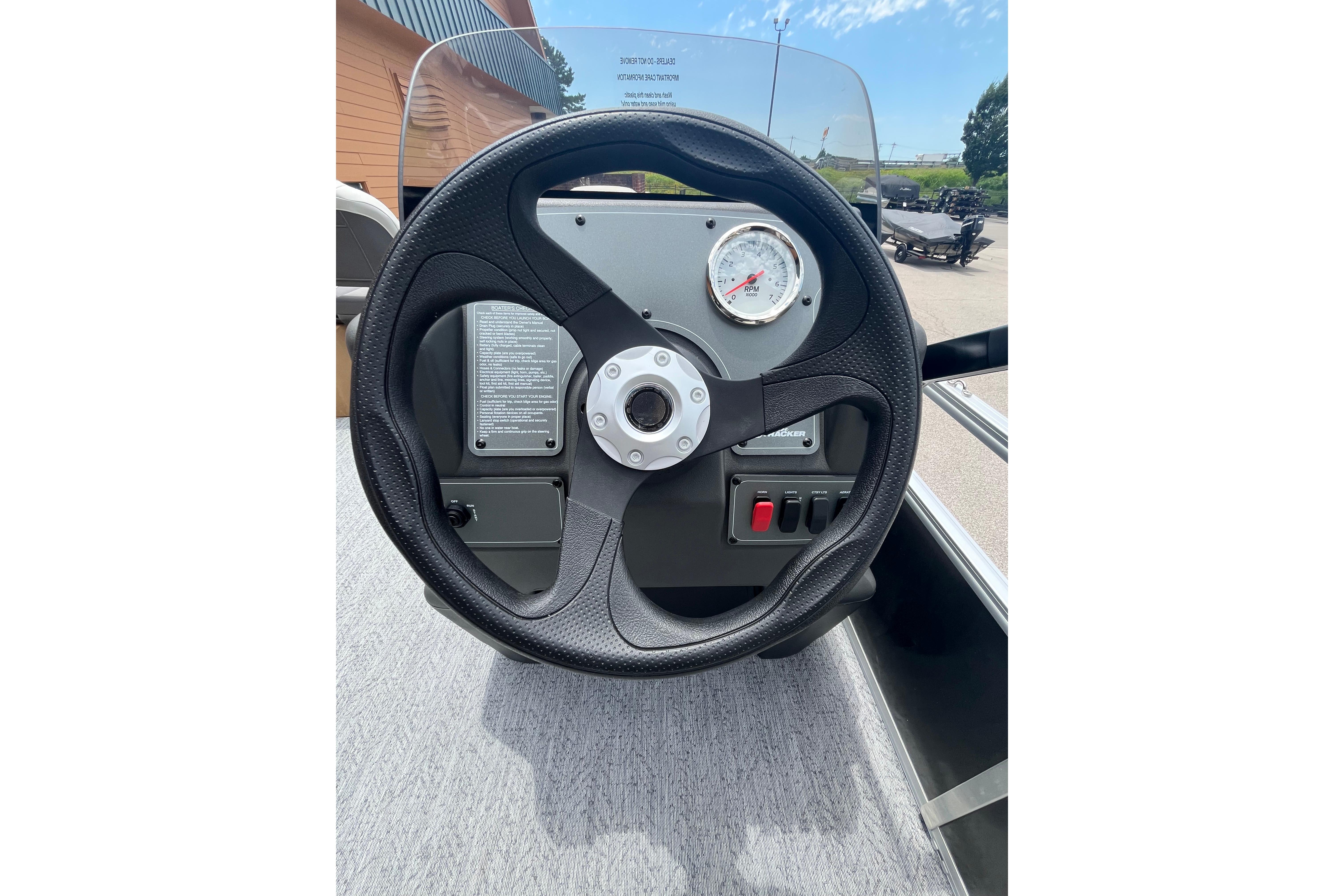 Steering wheel and dashboard of 2026 Sun Tracker Bass Buggy 16 XL Select boat.