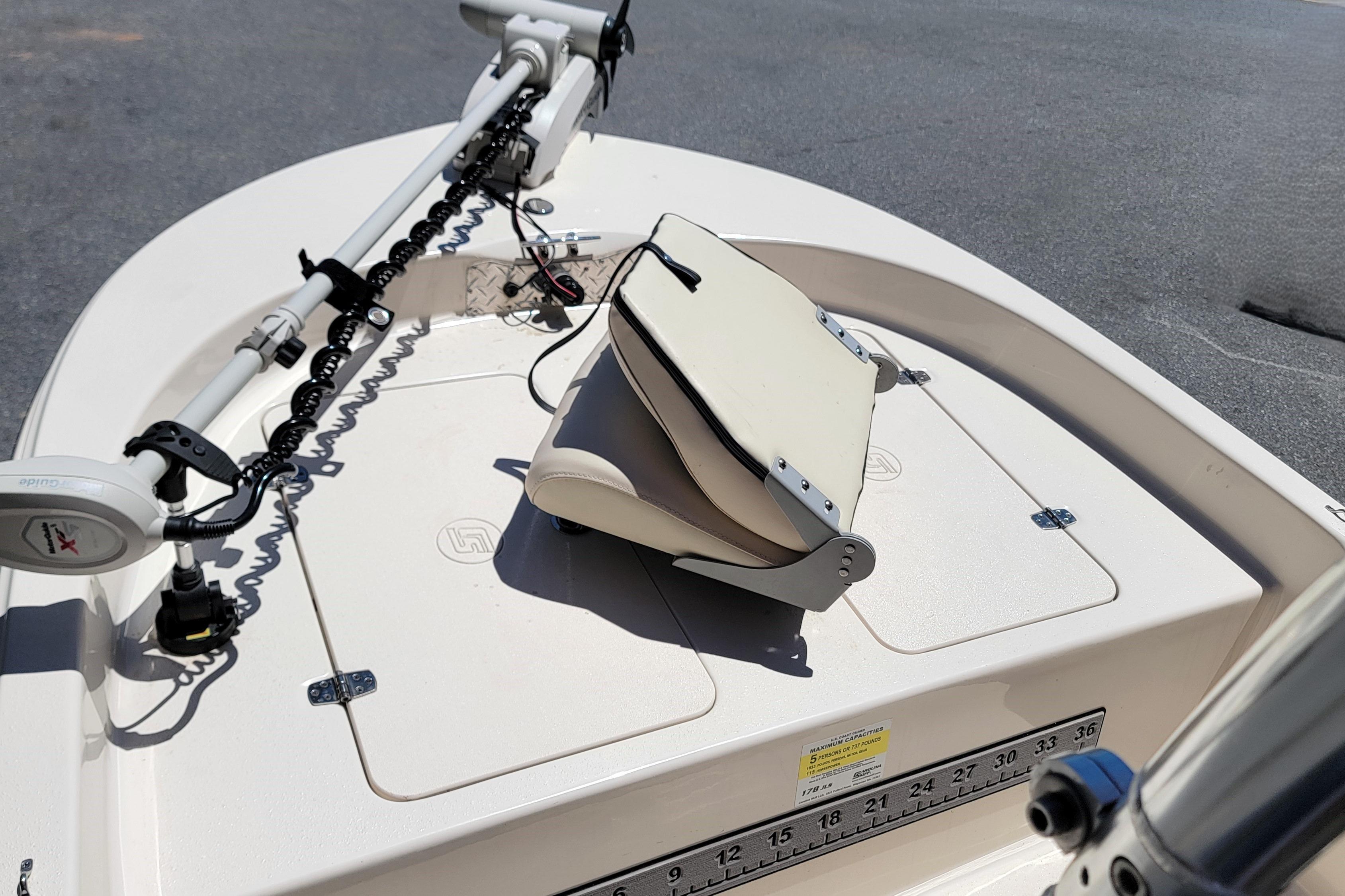 2021 Carolina Skiff 178 JLS boat deck with trolling motor and folded seat.