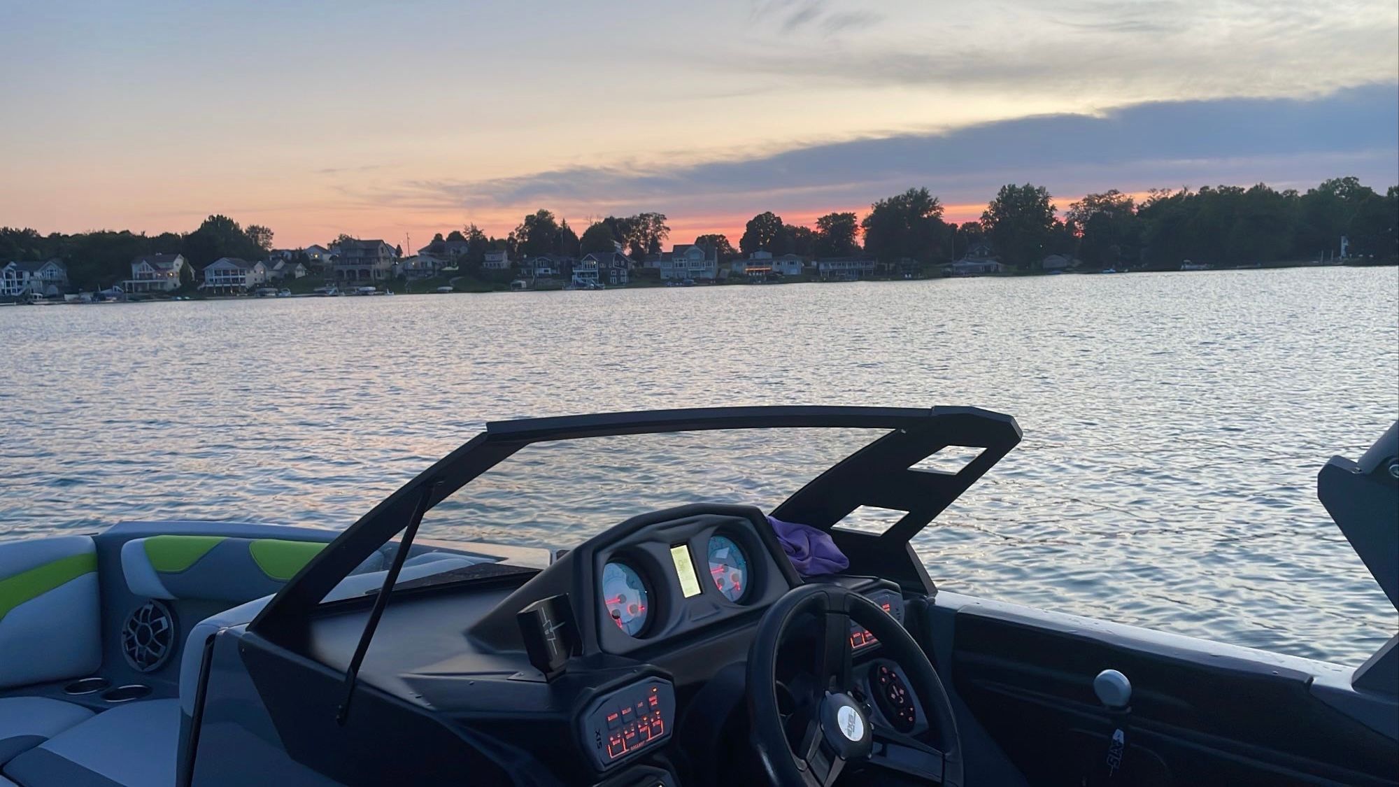 2019 Axis A22 at sunset on a calm lake.